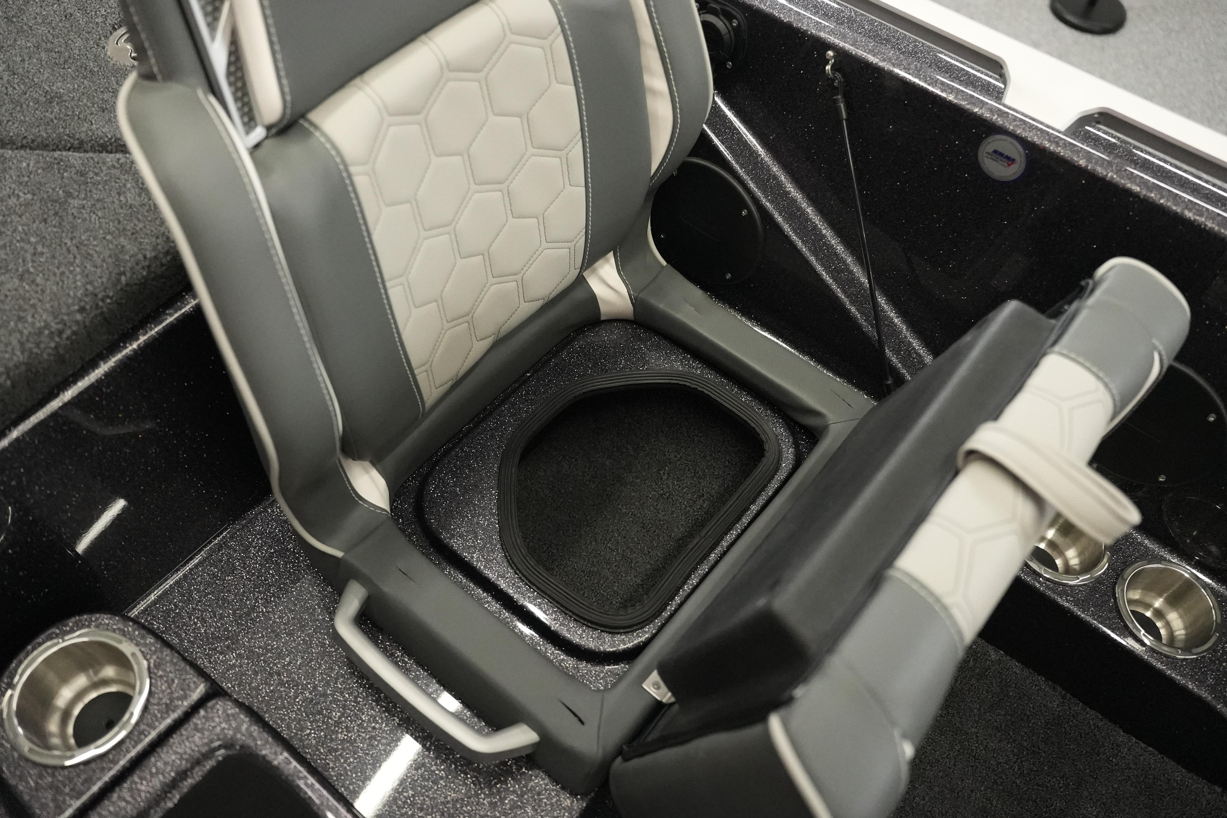 2026 Bass Cat Puma STS boat seat with storage compartment and cup holders.