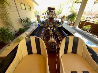 Interior view of a 1980 Sanger HYDRO V DRIVE with two seats and a powerful engine.