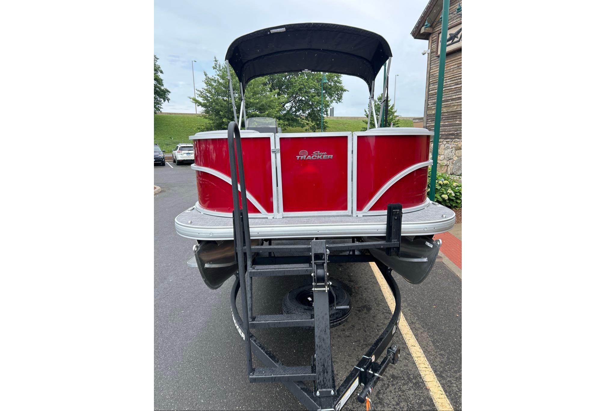 2026 Sun Tracker Party Barge 16 DLX pontoon boat on trailer, rear view.