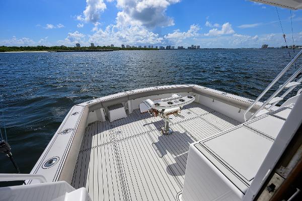 Viking 50 Convertible 2000 yacht deck overlooking ocean and distant city skyline.