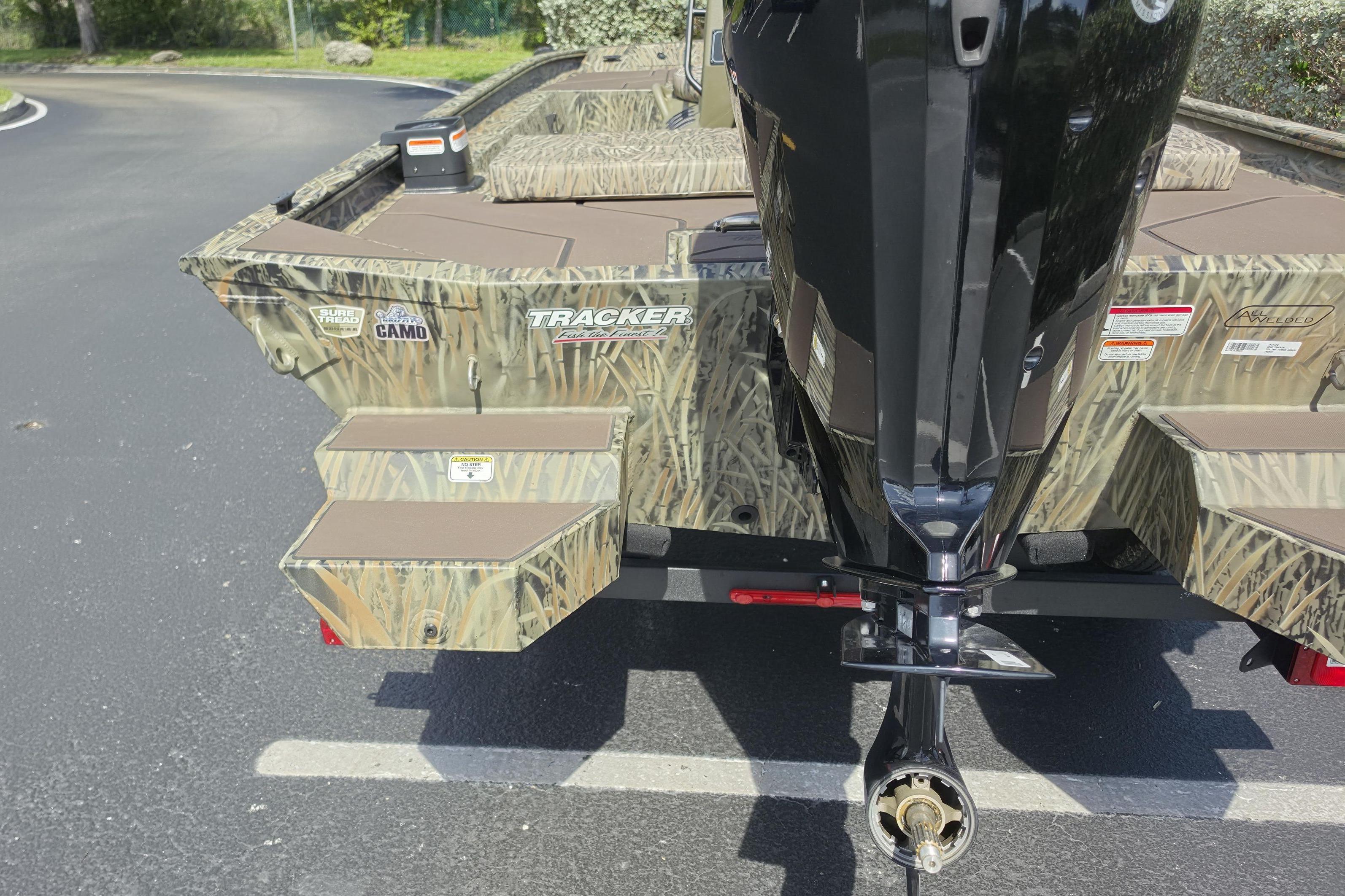 2026 Tracker Grizzly 1860 CC boat with camouflage design.
