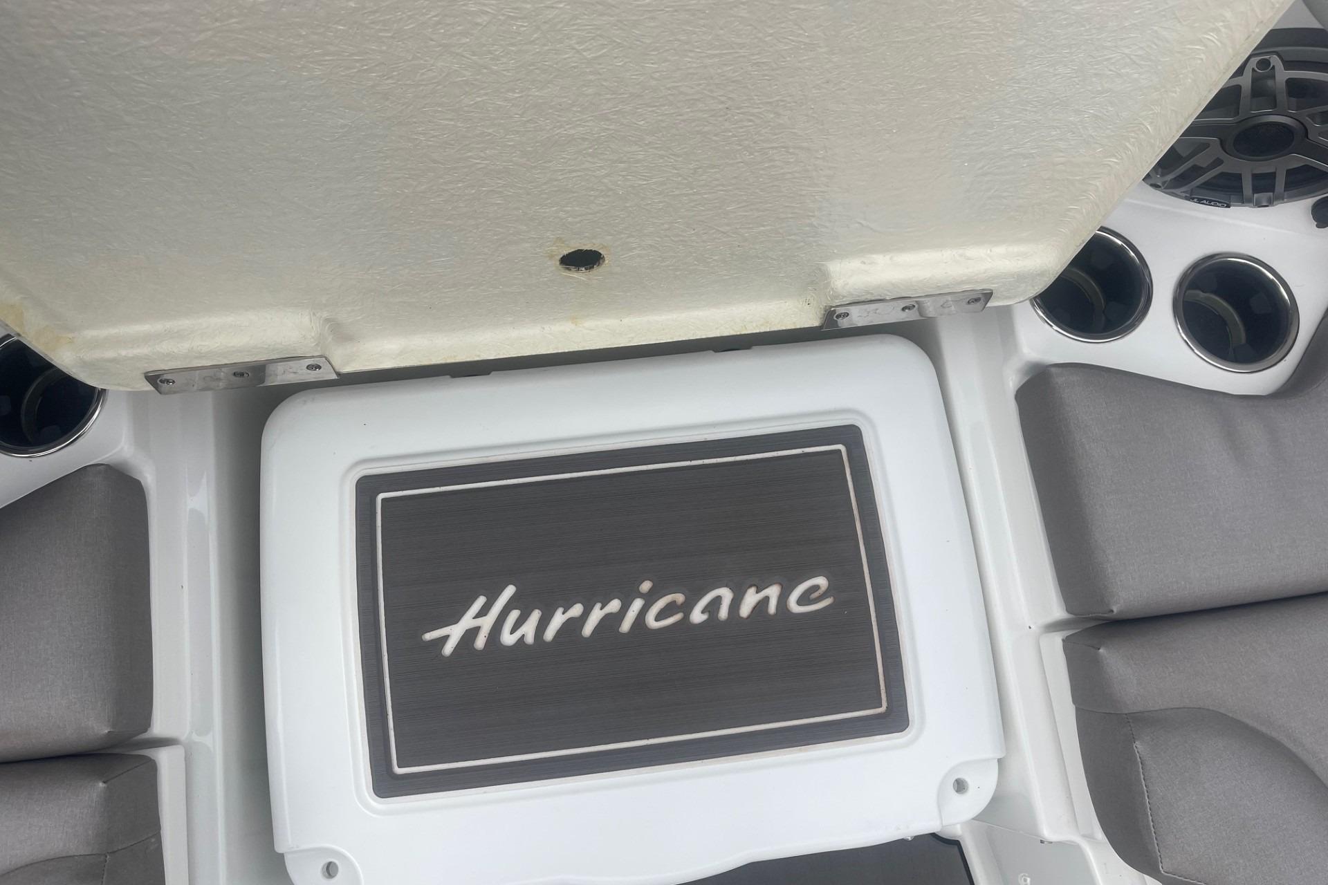 2025 Hurricane Center Console 24 OB boat interior with logo and cup holders.