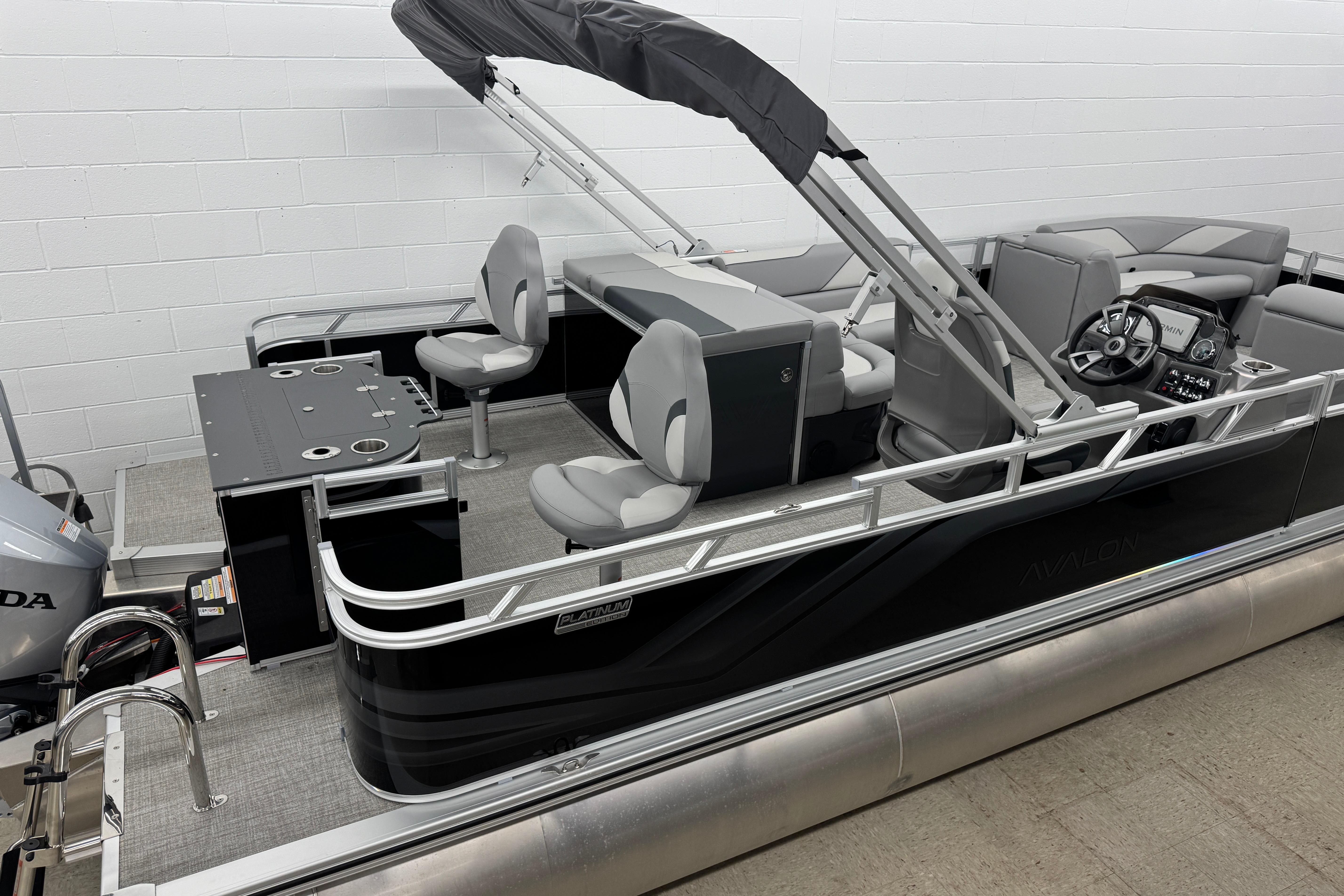 2026 Avalon Ventue 85 RF pontoon boat with sleek design and modern seating arrangement.