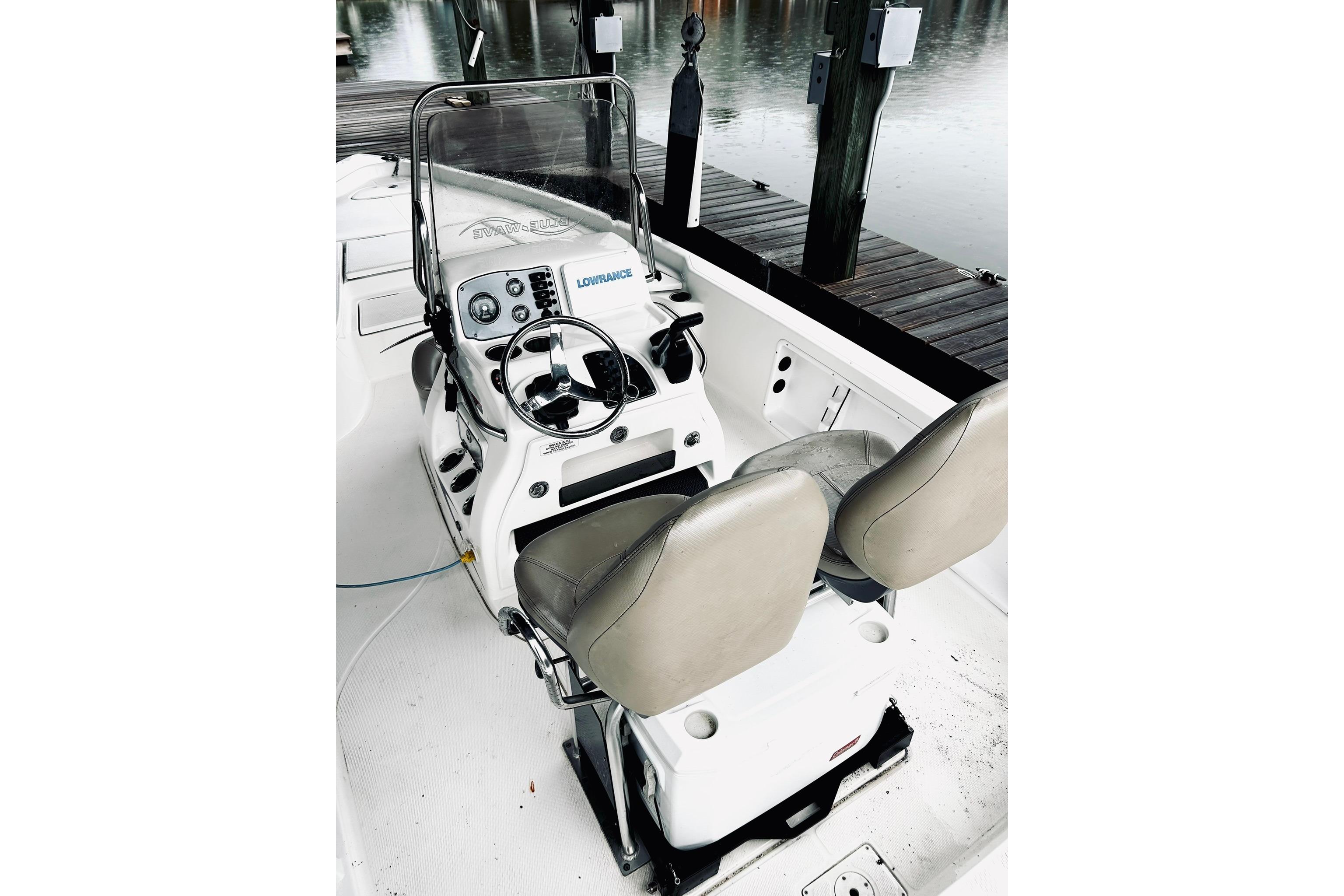 2017 Blue Wave 2200 PureBay boat interior with steering console and dual seats.
