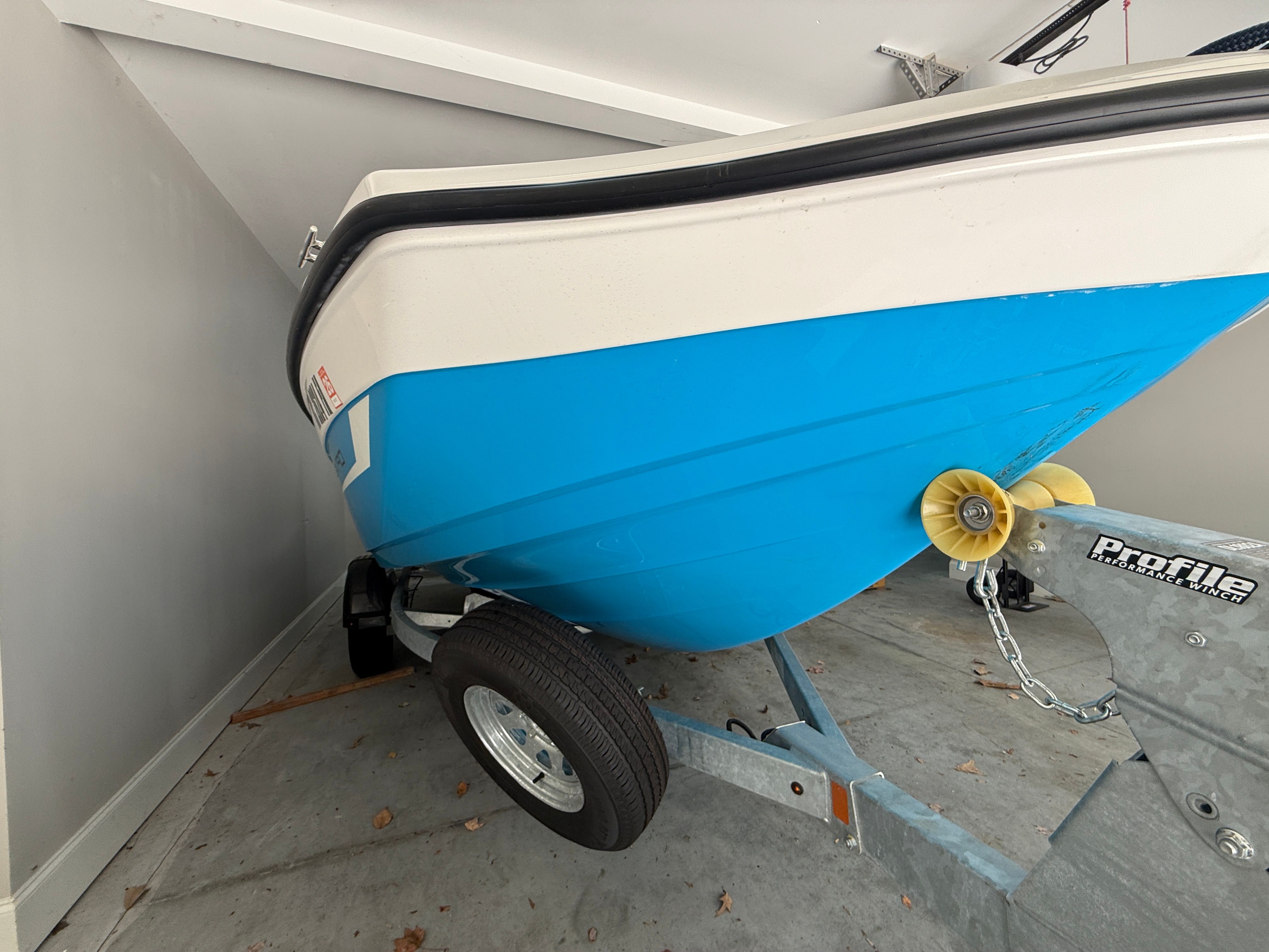 Yamaha SX190 boat 2023 on trailer in garage.