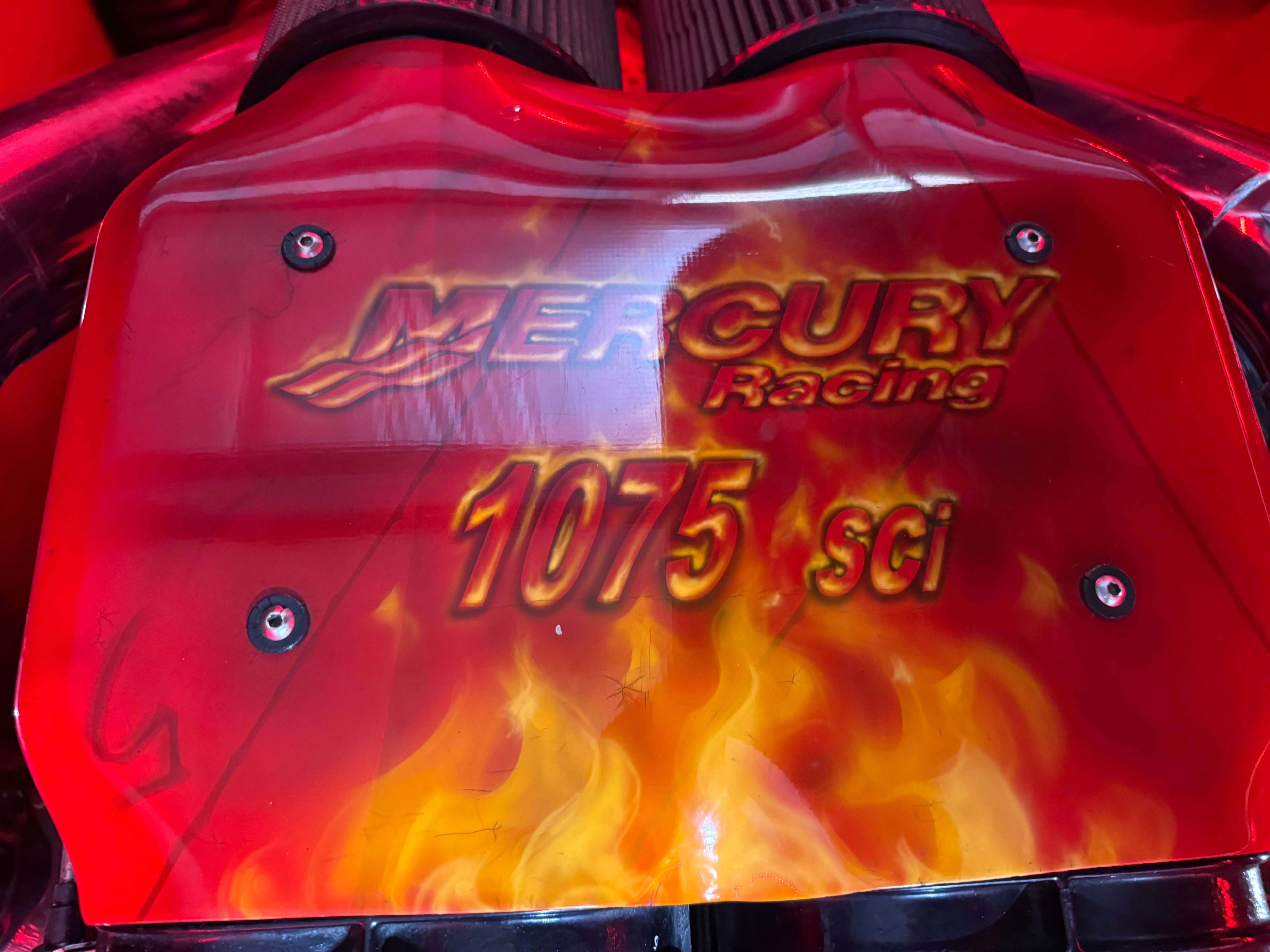 Close-up of a Mercury Racing 1075 sci engine with a flame-like design.