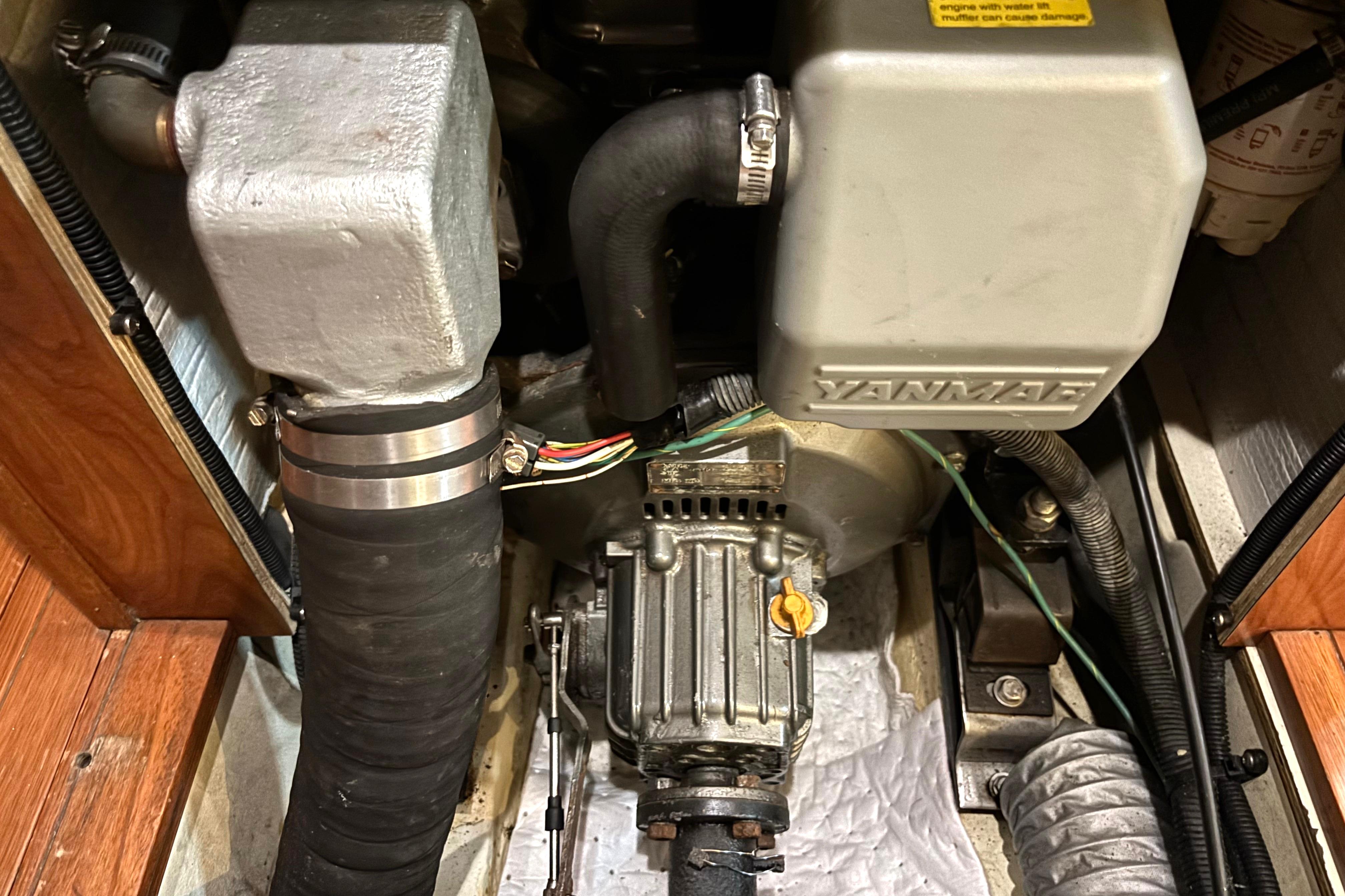 Engine compartment of a 2011 Hunter 39 sailboat featuring a Yanmar engine.