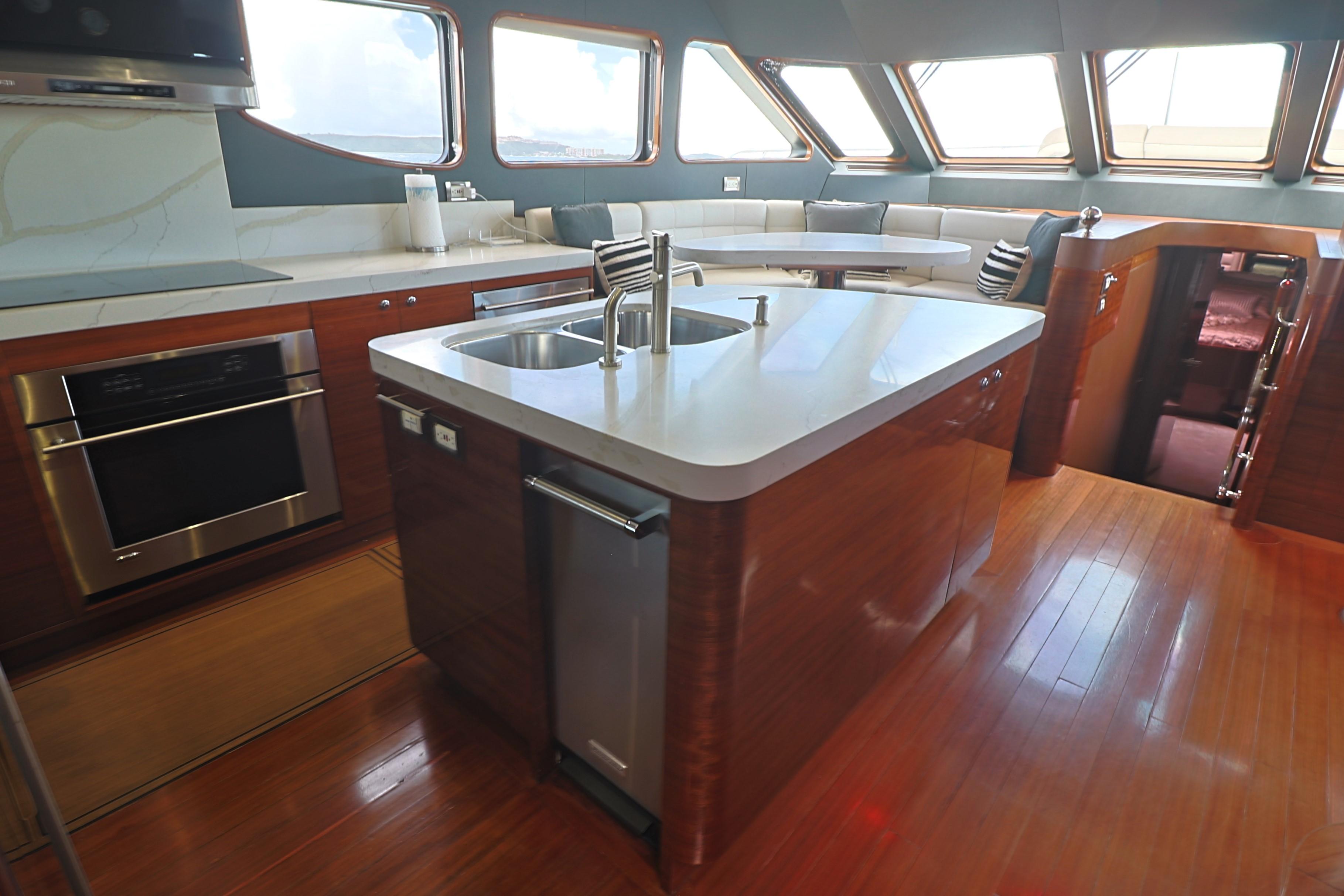 Luxurious 2013 Cheoy Lee Bravo yacht kitchen with modern appliances and sleek design.