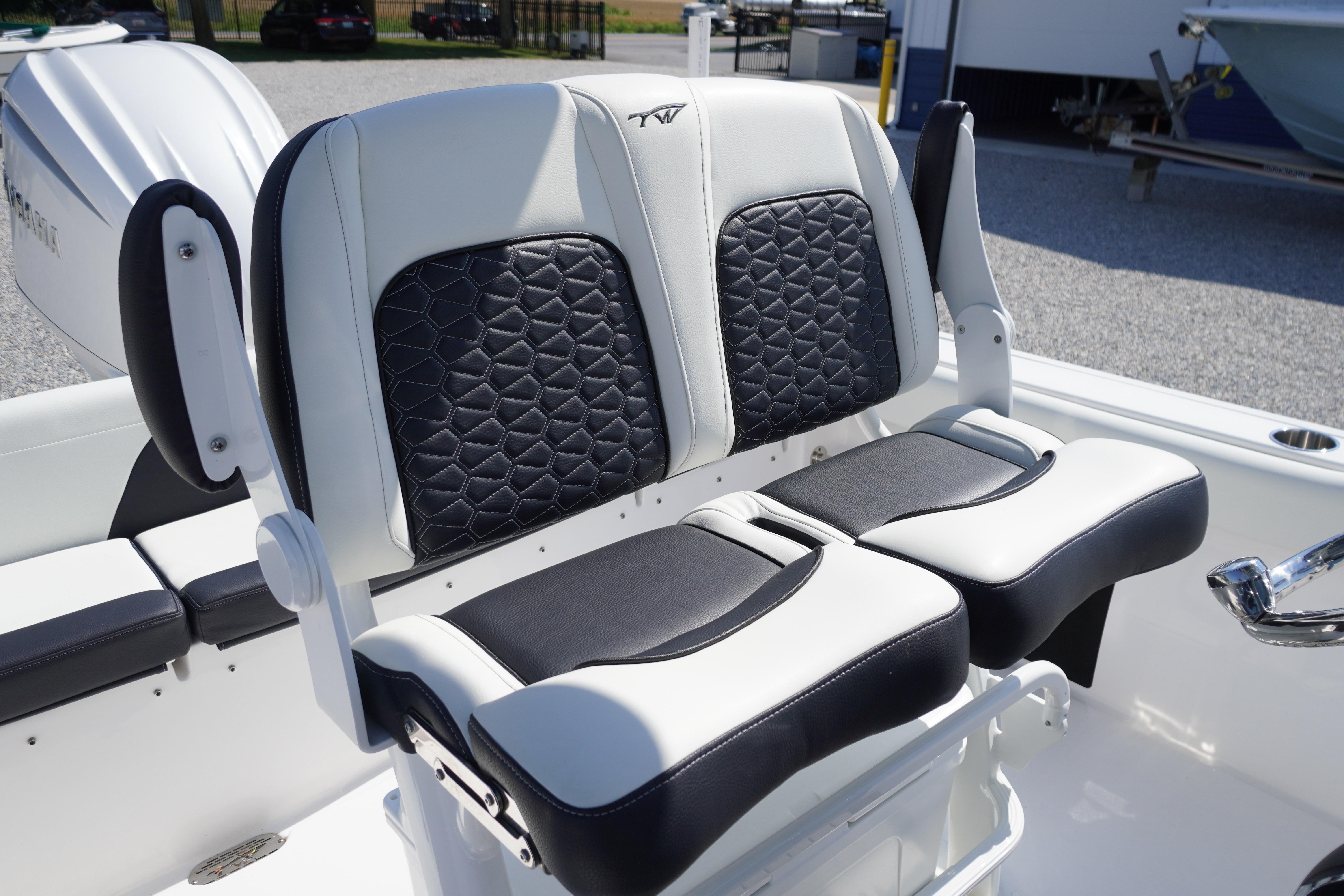 2025 Tidewater 232 SS boat seats with black and white upholstery, outdoor setting.
