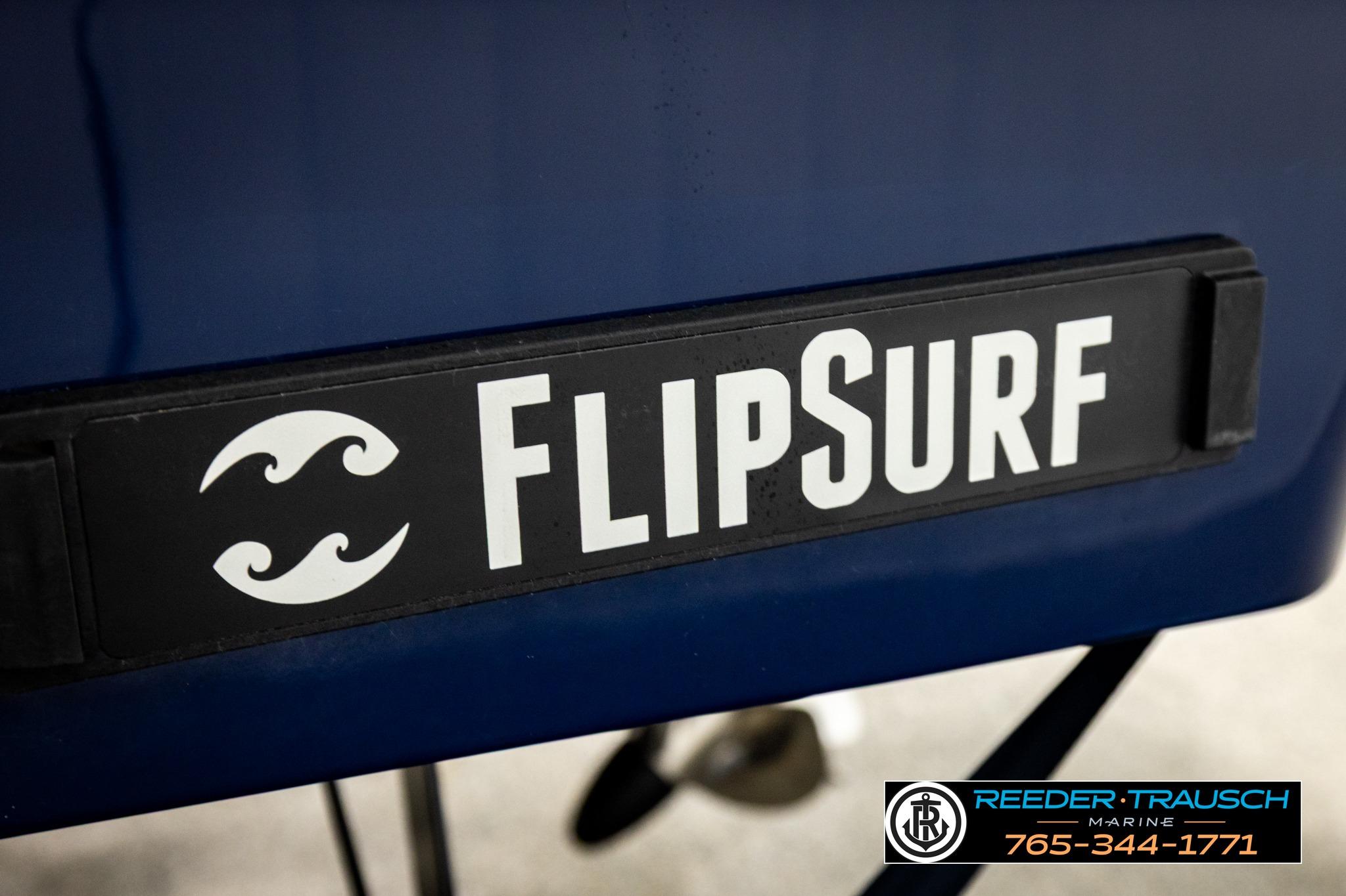 2024 FOURWINNS HD5 Surf boat featuring FlipSurf technology, Reeder-Trausch Marine branding visible.