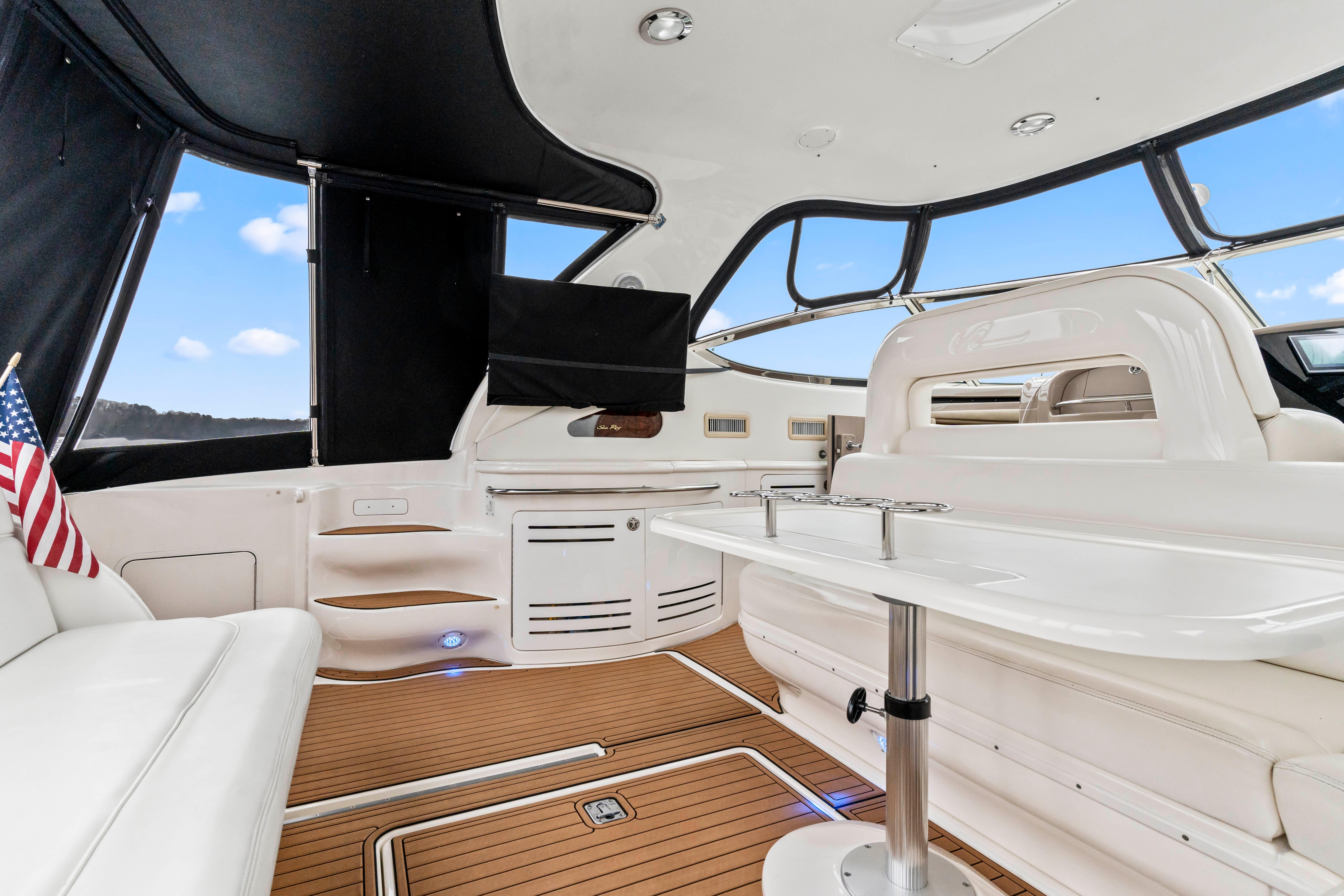 Luxurious interior of 2001 Sea Ray Sundancer 510 yacht with elegant seating and table.