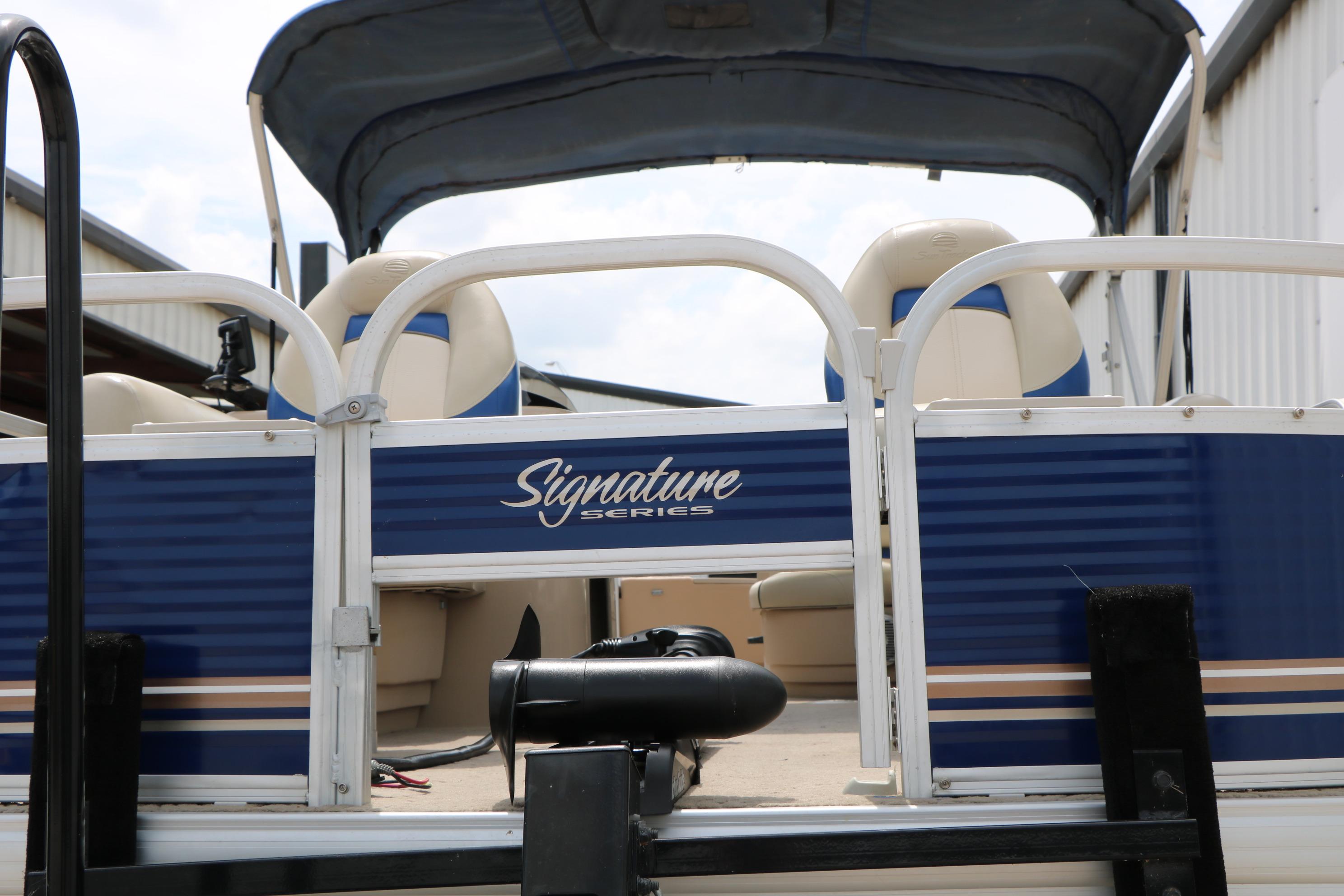 2013 Sun Tracker Fishin' Barge 20 DLX pontoon boat, Signature Series, blue and white design.