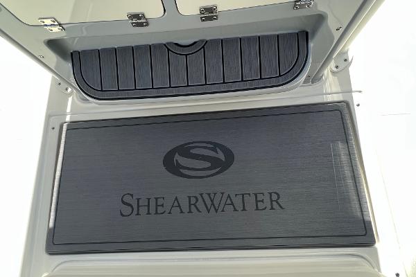 2024 ShearWater 270 SS Open Carolina boat deck with logo.
