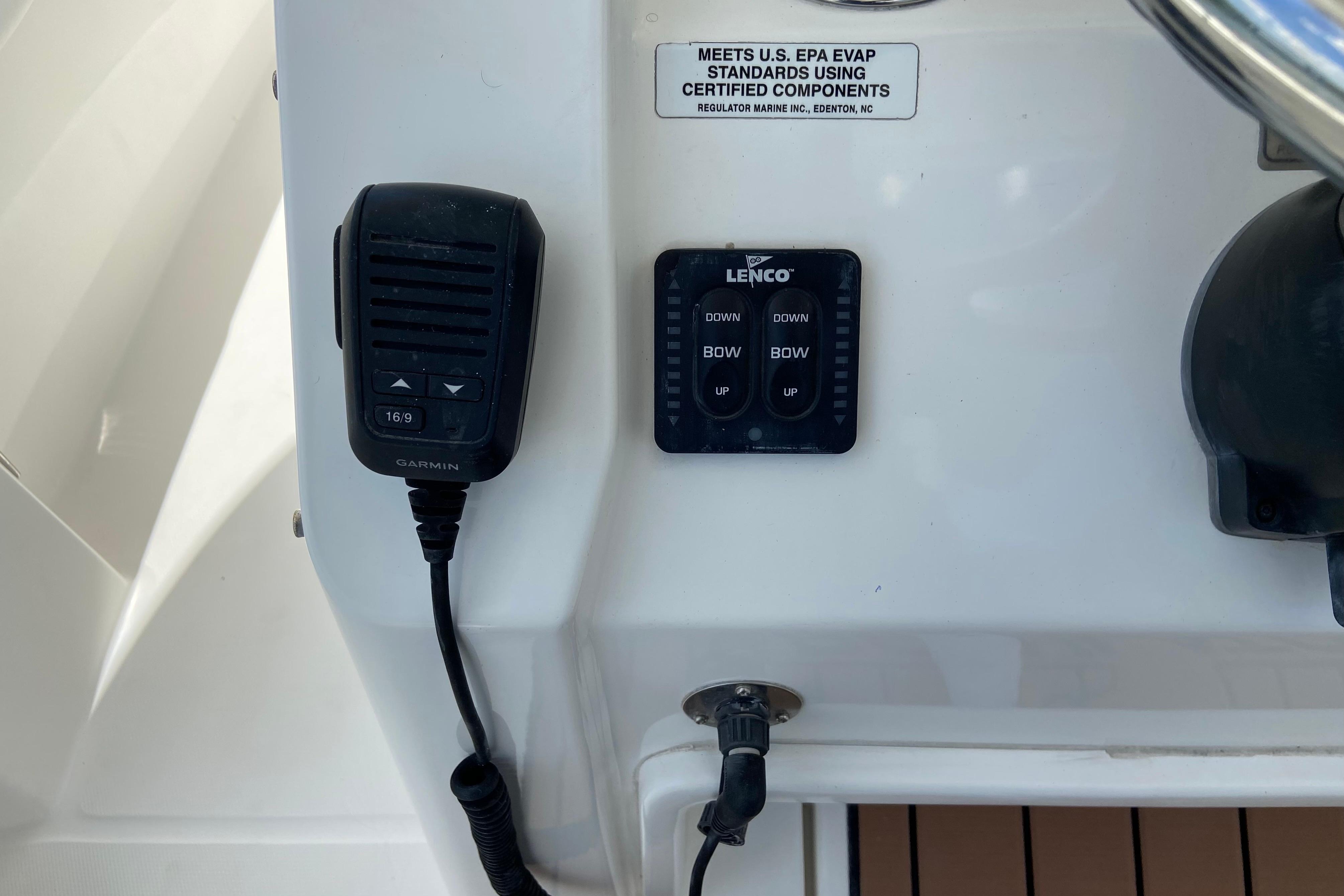 Control panel of a 2021 Regulator 28 boat with Garmin and Lenco devices.