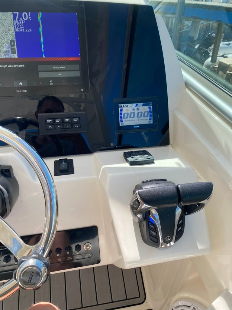 2023 Cobia 330 boat helm with Garmin display.