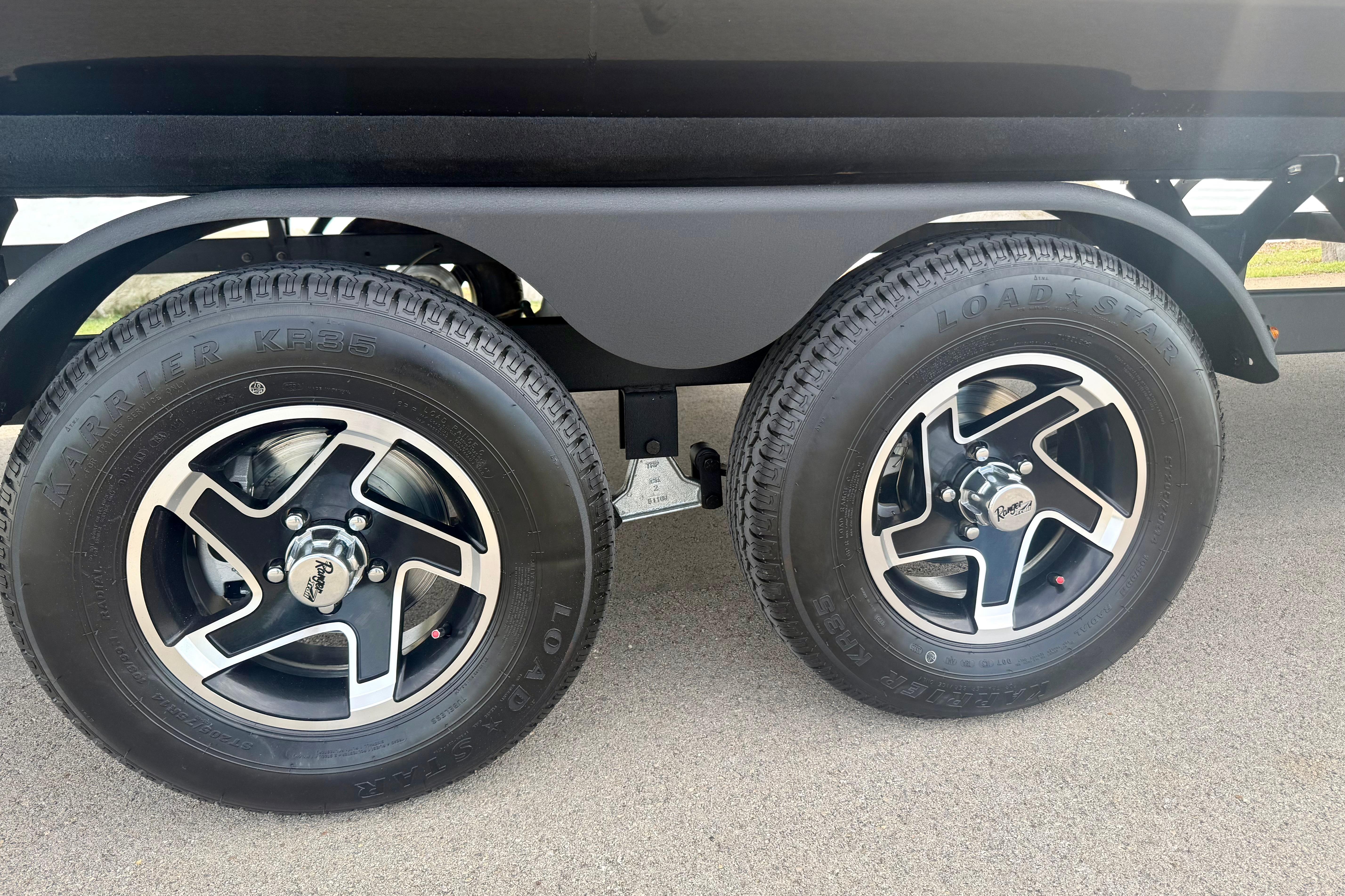 2026 Ranger 223FC trailer wheels with Loadstar tires on pavement.