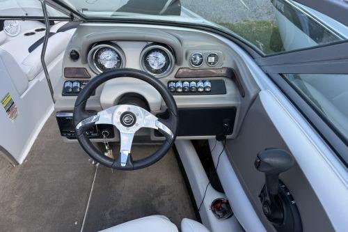 2012 Crownline 215 SS boat dashboard with steering wheel and control panel.