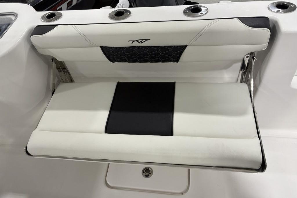 2026 Tidewater 232 CC Adventure boat seat with black and white upholstery.