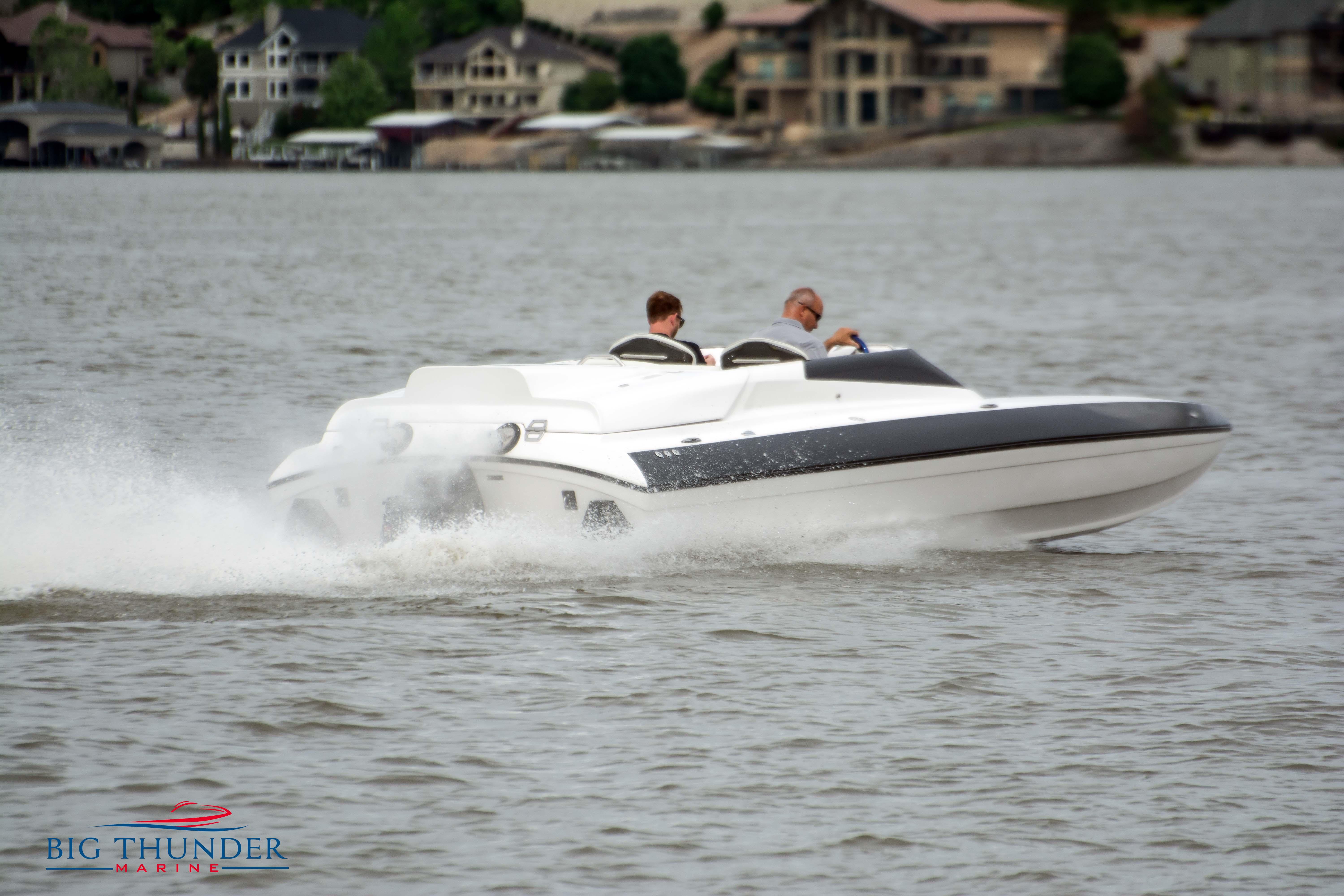 2019 Spectre Screaming Eagle 22 Talon speedboat cruising on a lake.