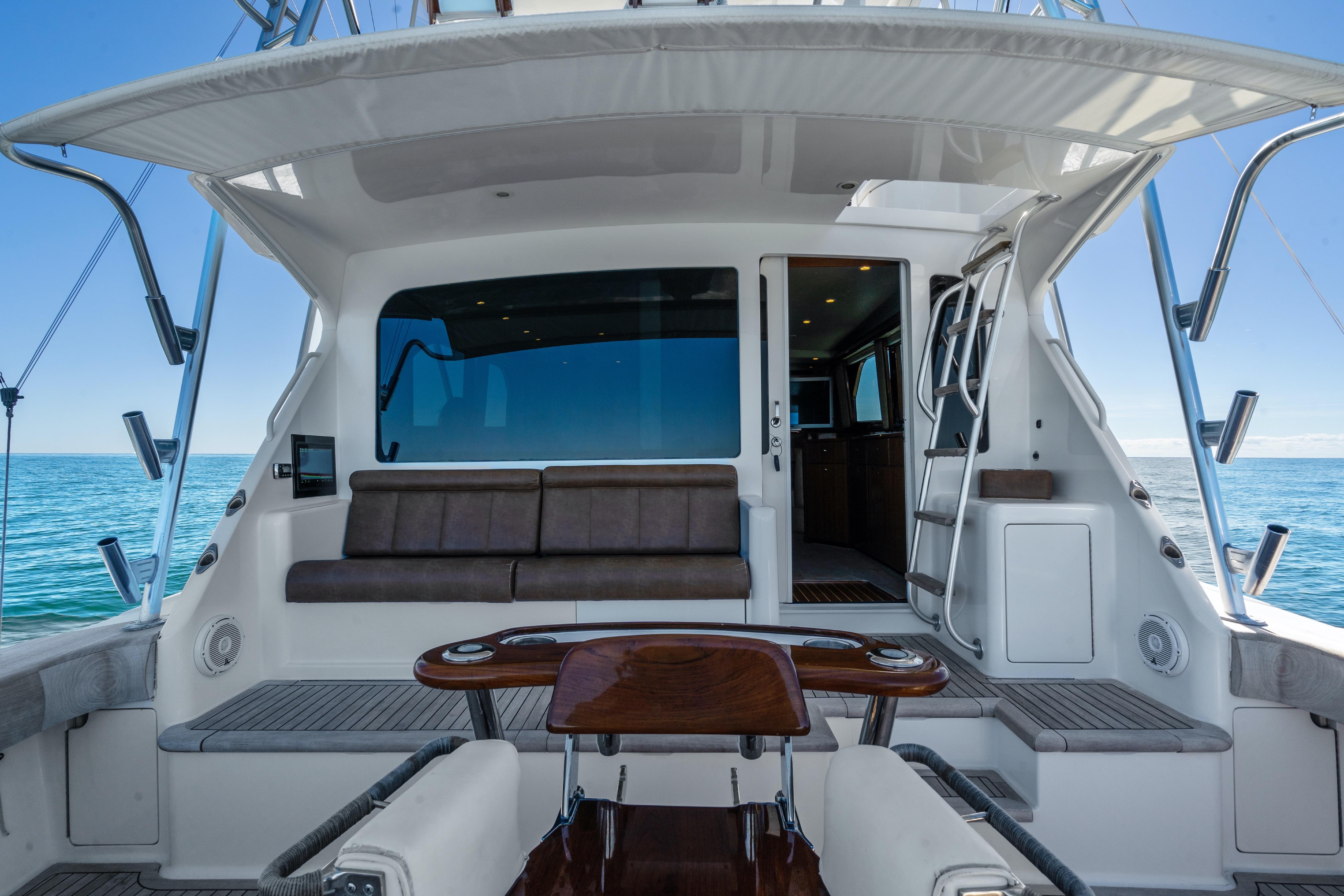 2007 Viking 56 Convertible yacht interior with seating, ocean view, and ladder access.