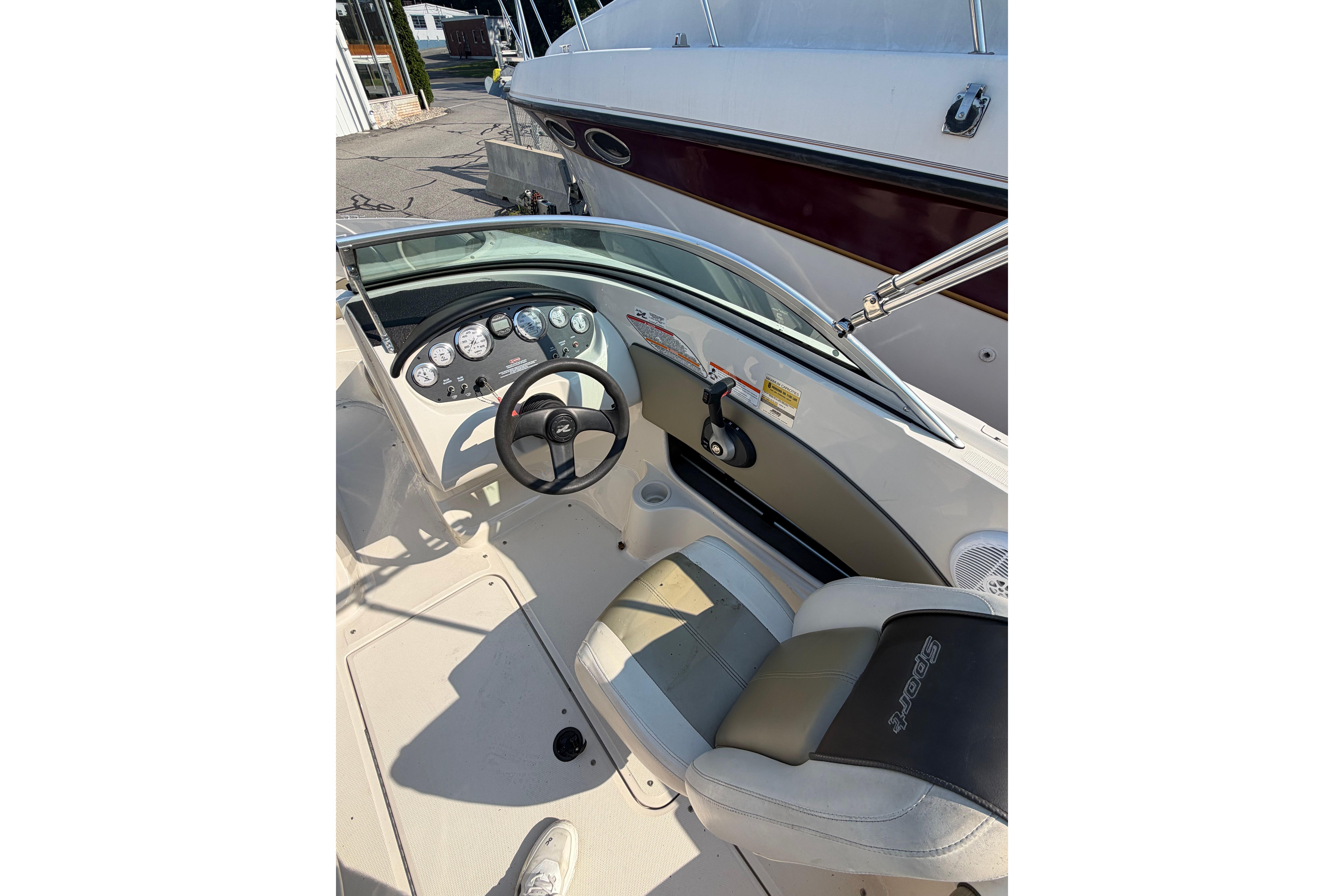 2006 Sea Ray 195 Sport boat interior with steering wheel and dashboard controls.