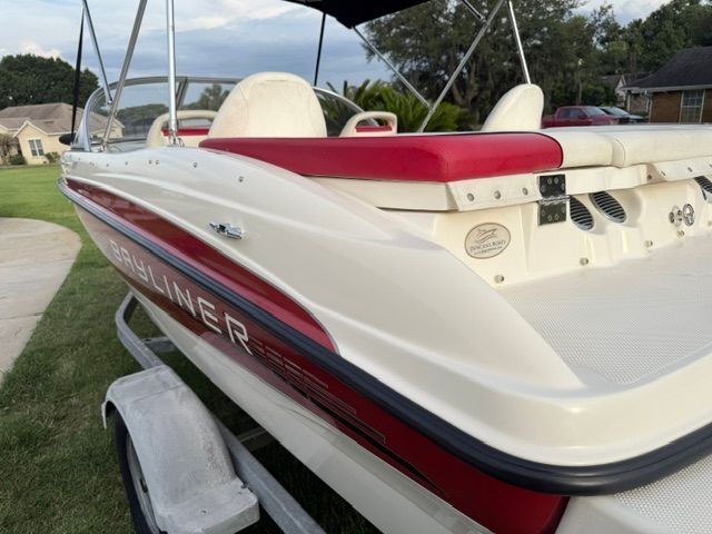 2012 Bayliner 184 SF boat on trailer, red and white upholstery.