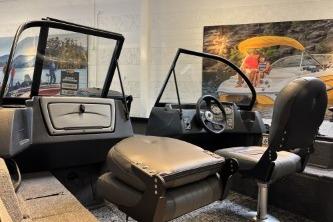 2026 Tracker Pro Guide V-16 WT boat interior with seating and steering console.