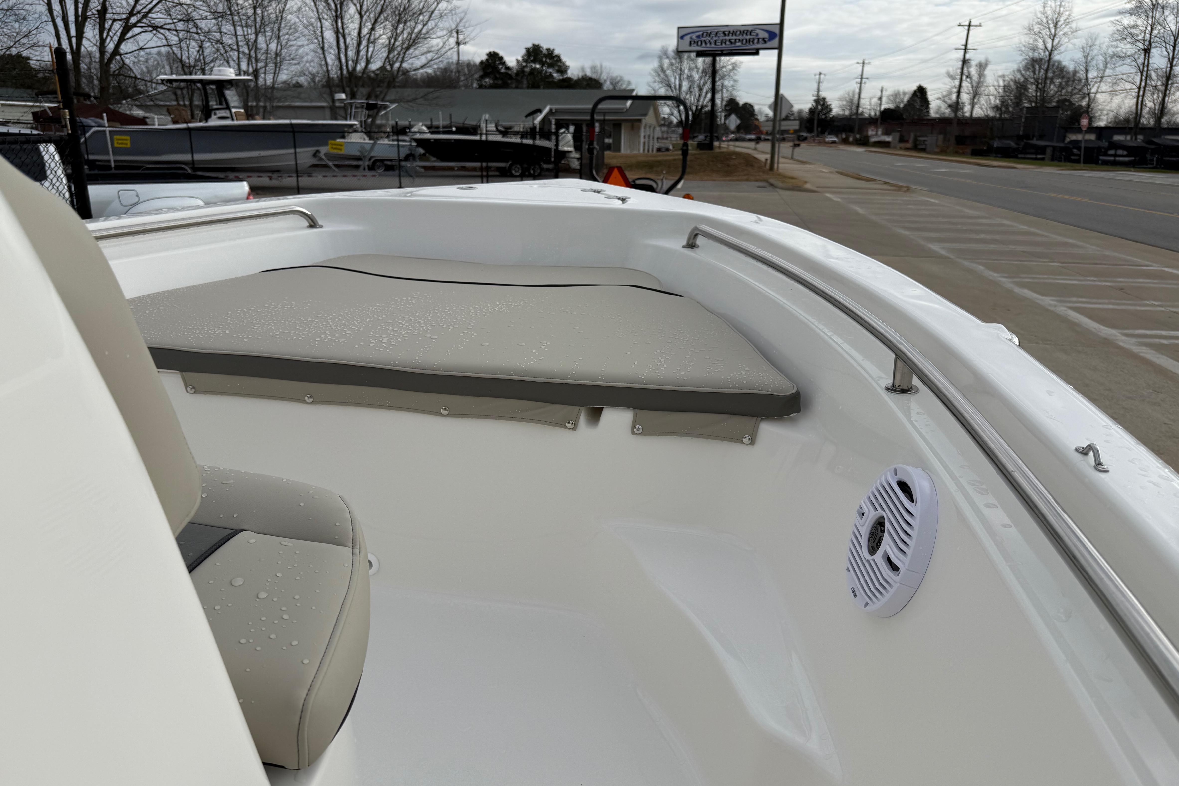 2026 Key West 189 FS boat interior with cushioned seating and speaker.