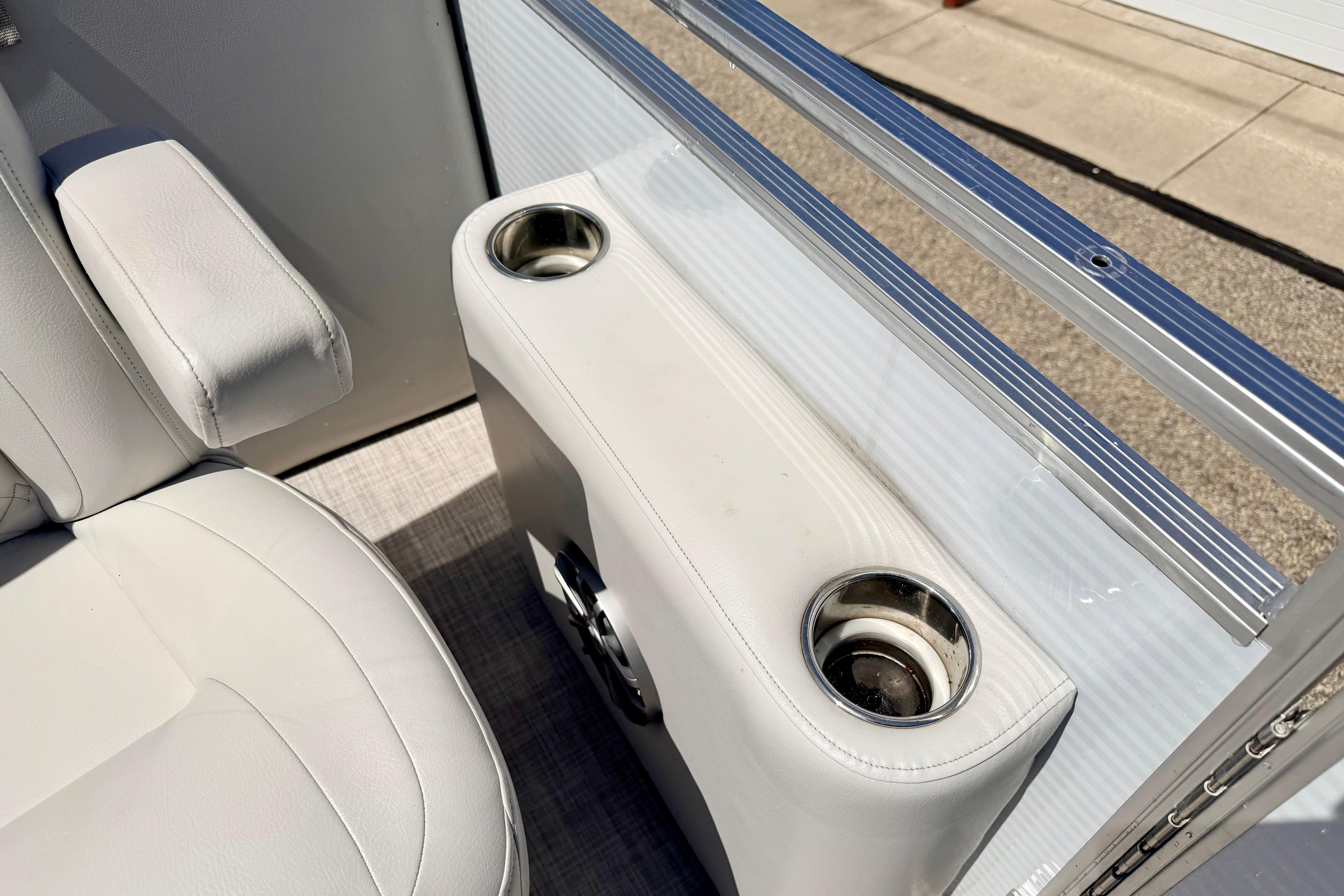 Crestliner 240 Rally DX CW 2019 boat interior with cup holders and seating detail.