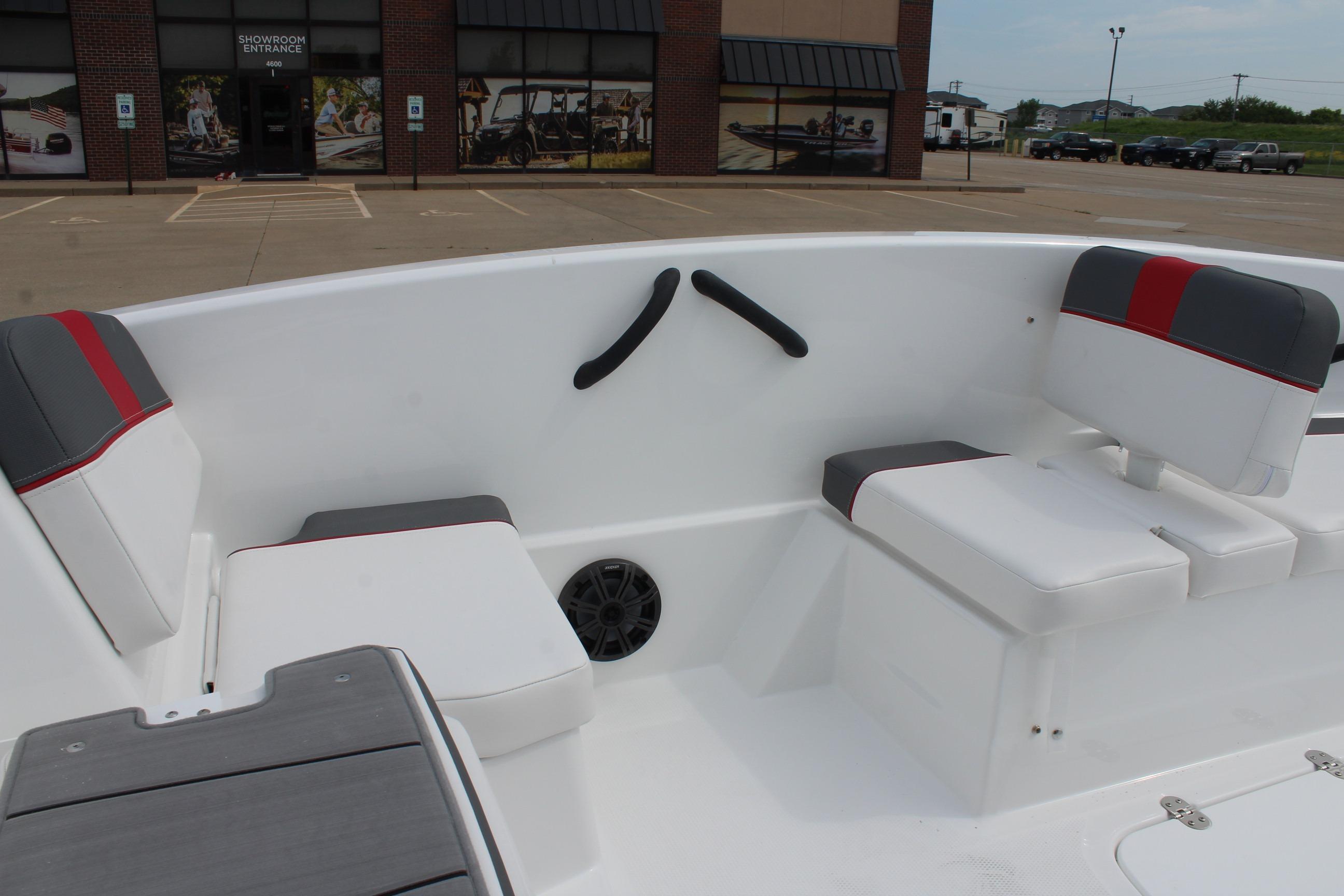 2026 Tahoe T16 boat interior with white and gray seating, red accents, and speaker.