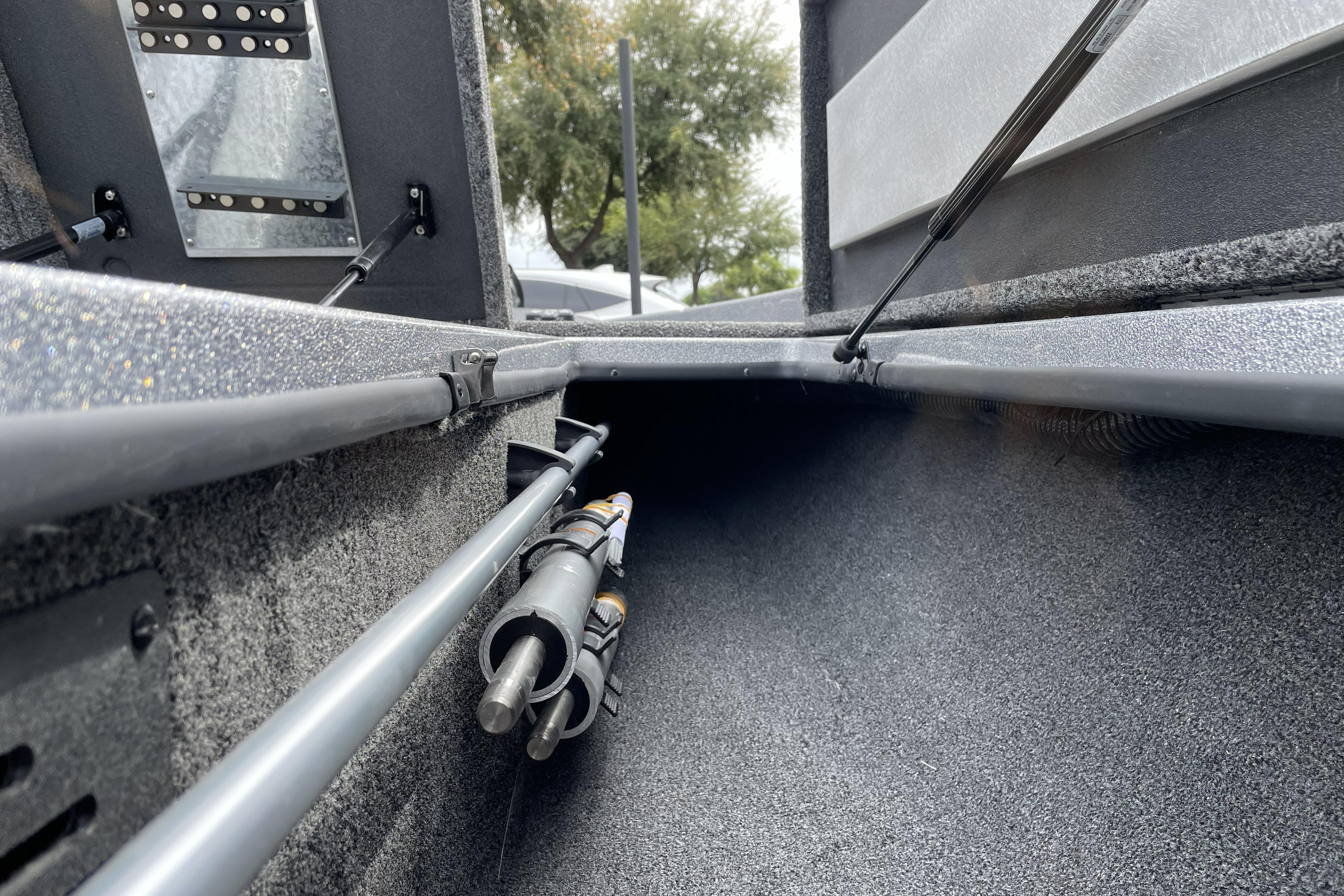 Interior view of 2026 Nitro Z21 XL boat storage compartment with hydraulic lift supports.