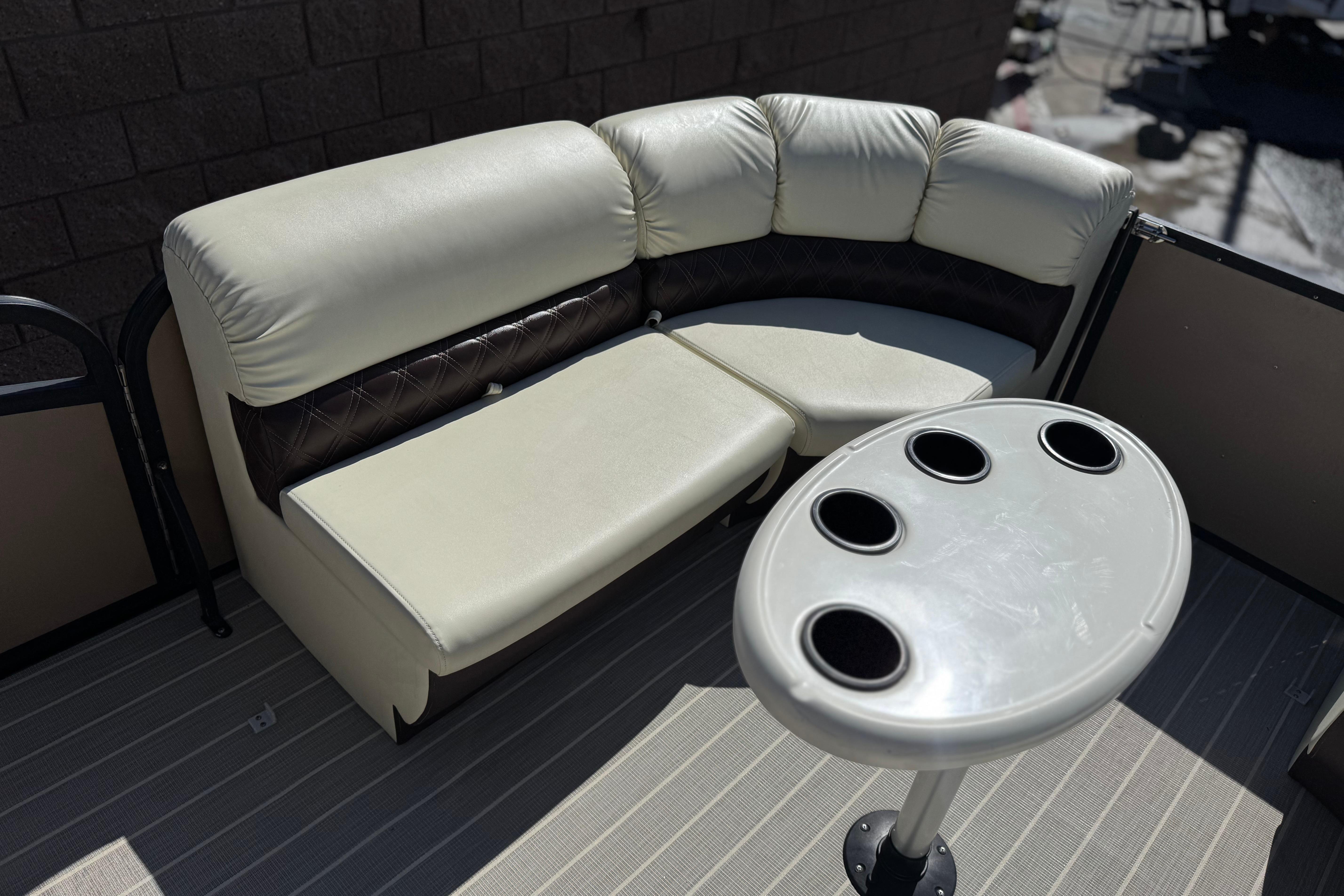 Luxurious seating and table on 2023 Lexington 623 ST Xtreme boat.