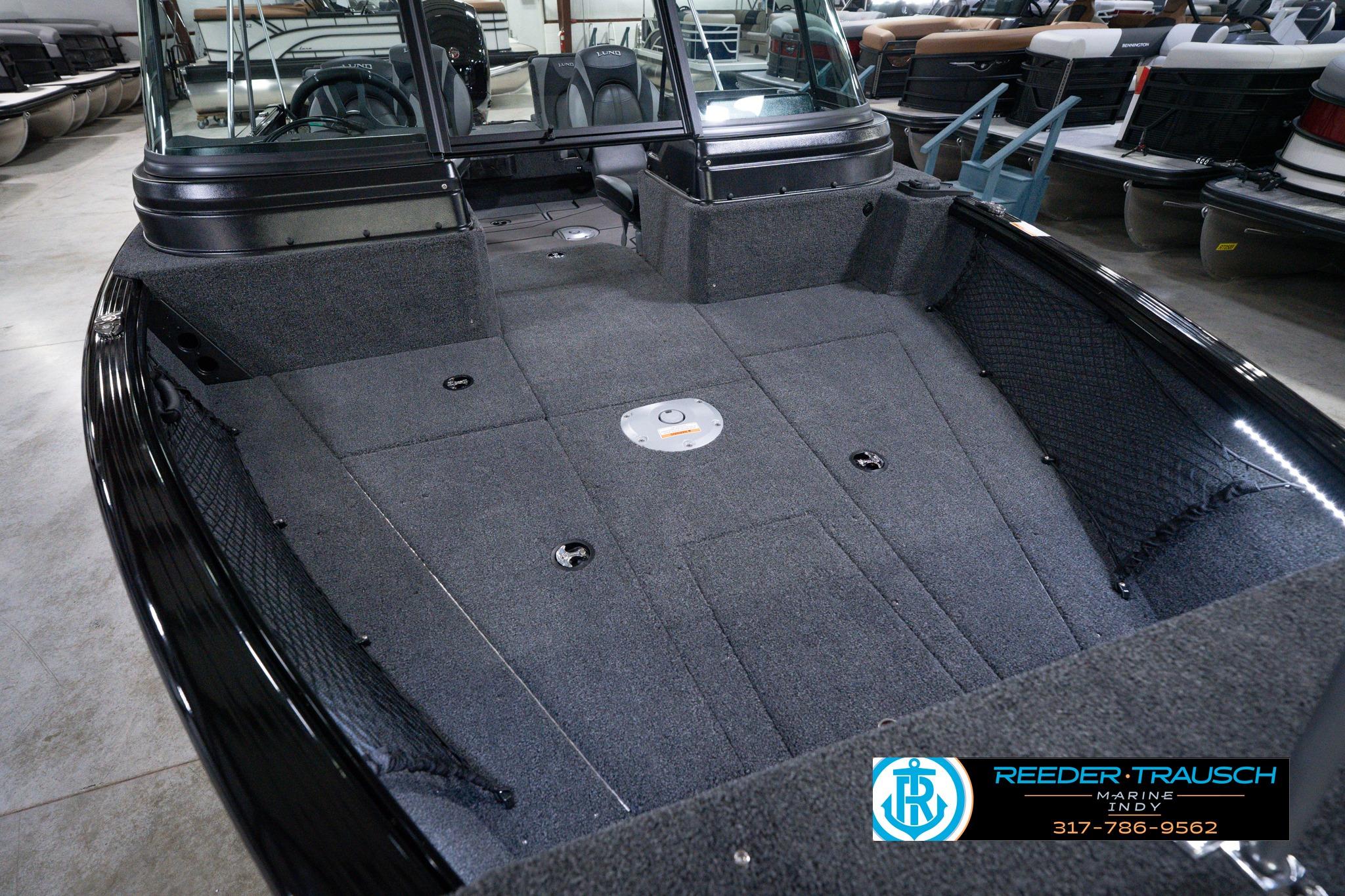 2026 Lund 1875 Impact XS SS boat interior with spacious deck and seating.