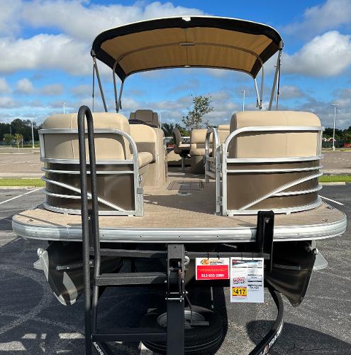 2023 Sun Tracker SportFish 22 XP3 pontoon boat in parking lot