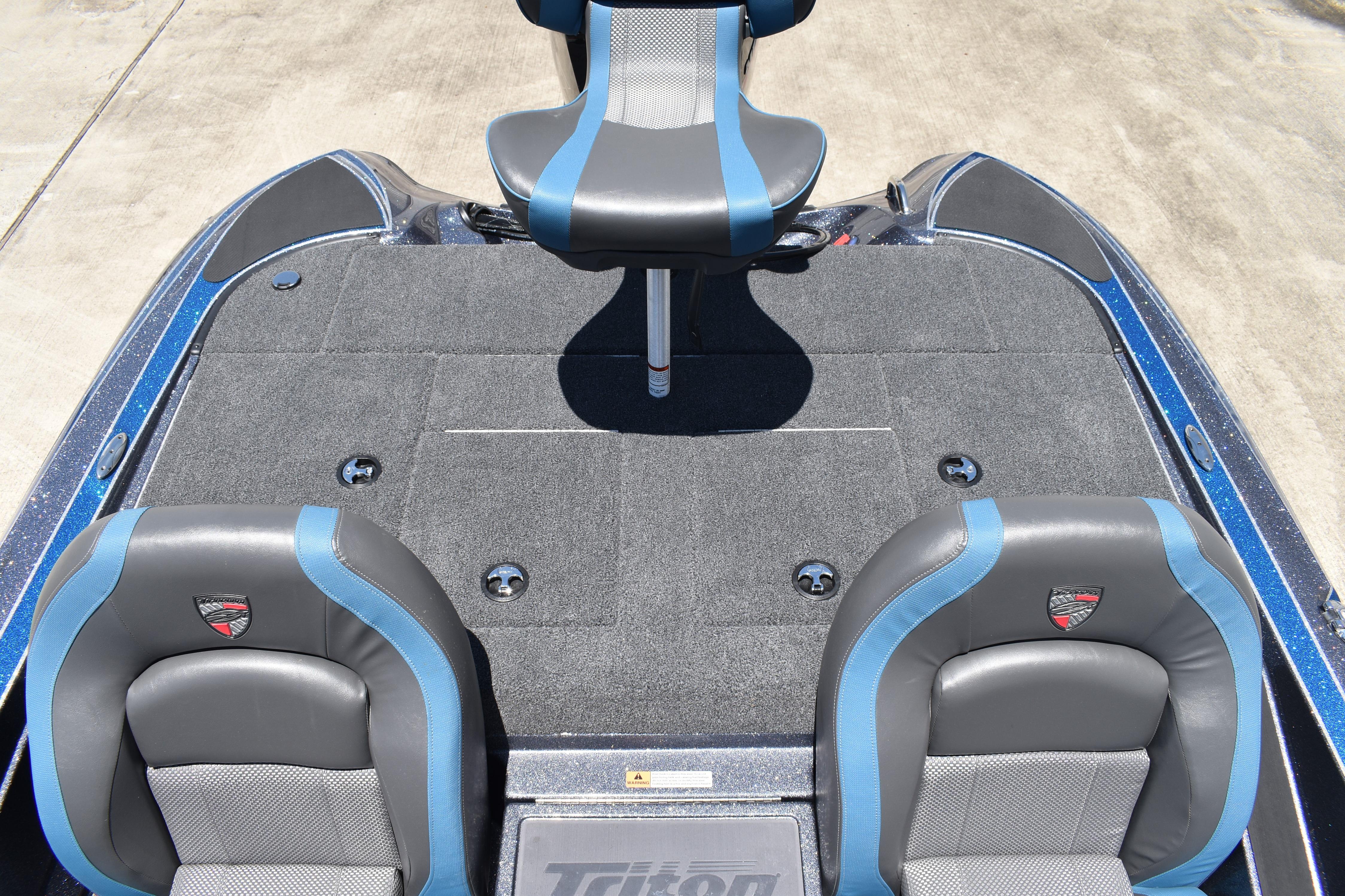 2026 Triton 179 TrX boat interior with blue and gray seating and carpeted deck.