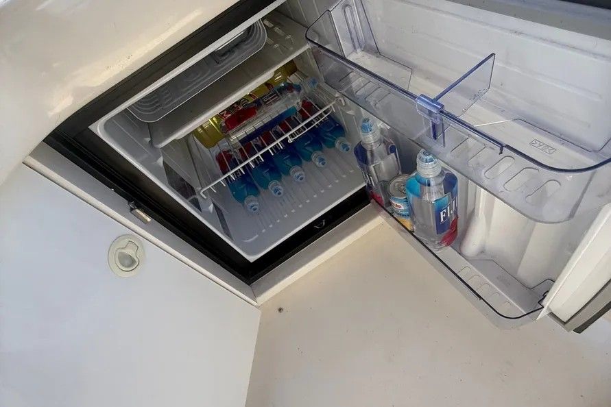 Refrigerator in Sea Ray Sun Sport boat, stocked with beverages.