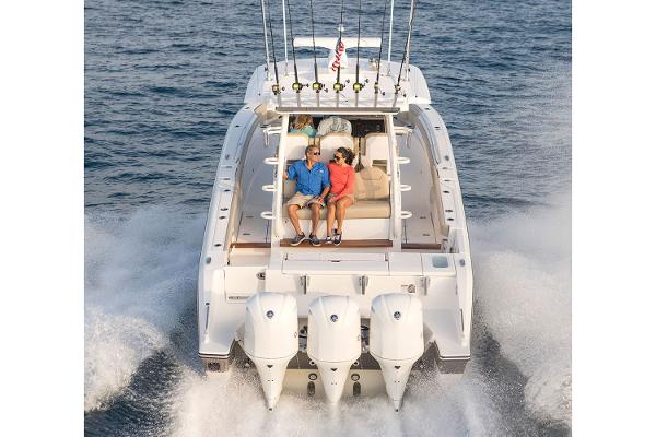 Manufacturer Provided Image: 2018 Pursuit S 368 Sport boat cruising with passengers on board.