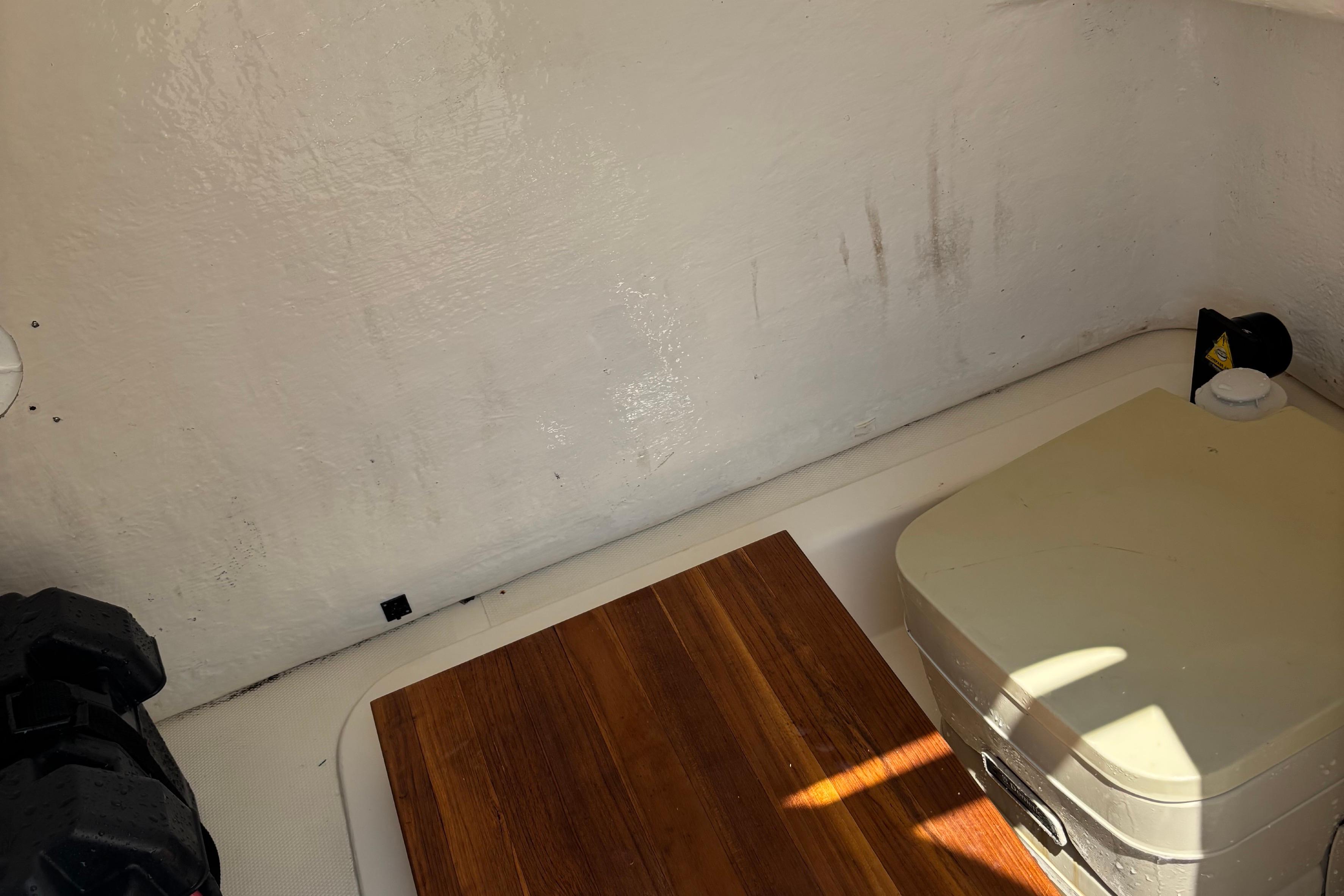 Interior of a 2007 Bristol Harbor 21 CC boat with wooden and plastic elements.
