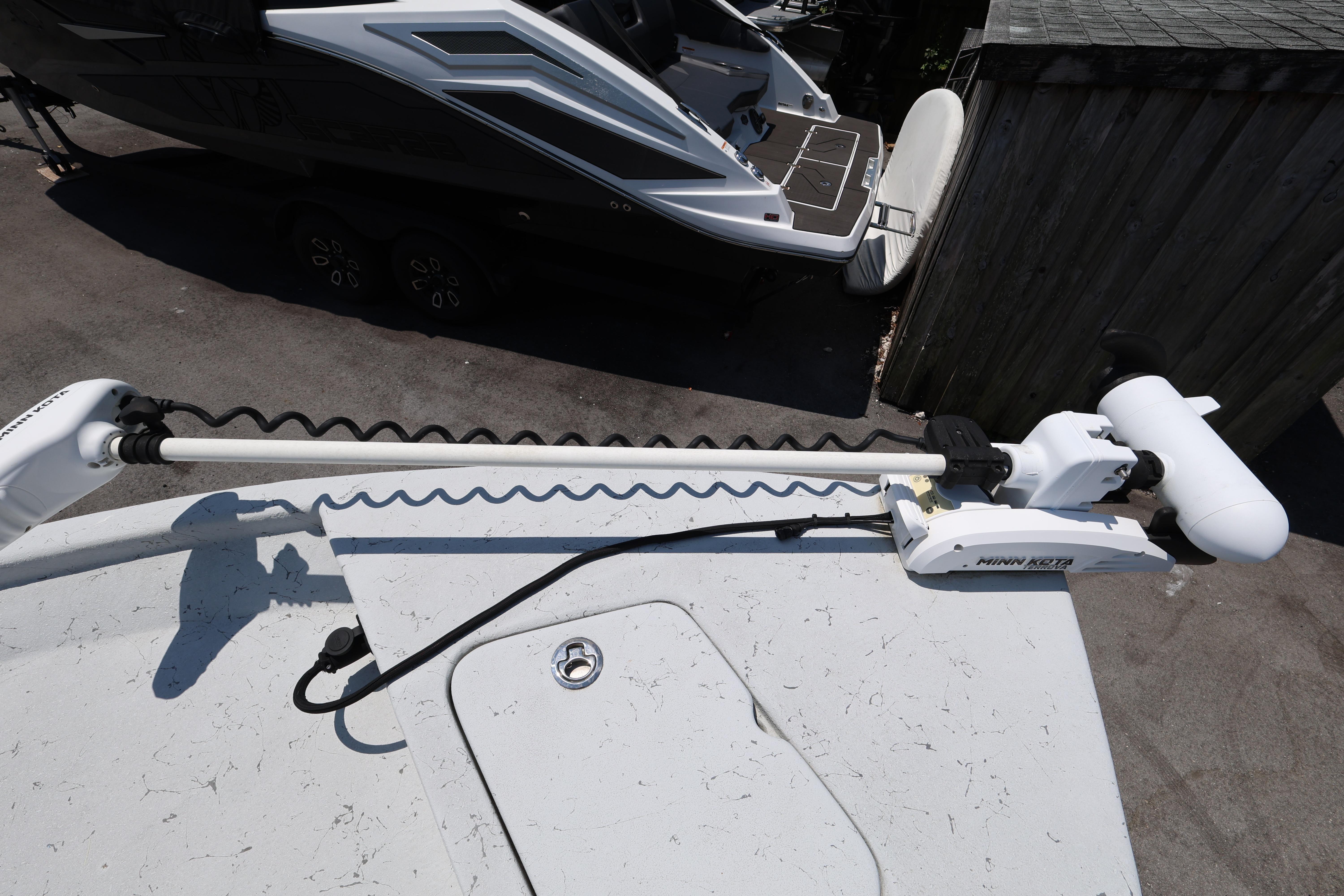 2021 Blazer Bay 2400 boat with Minn Kota trolling motor on deck.