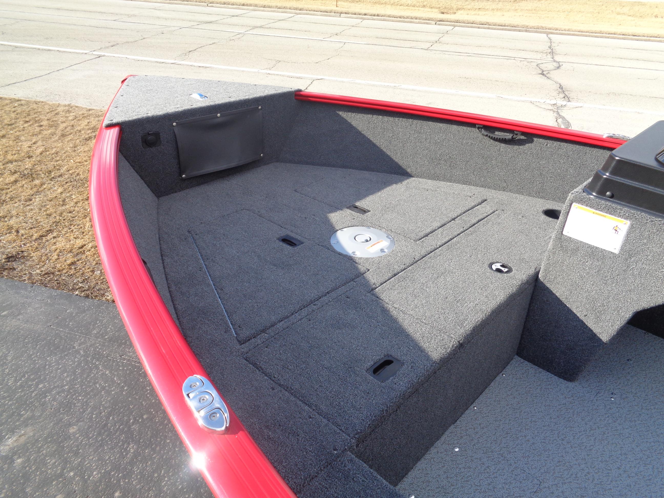 2025 Lund 1650 Rebel XL SS boat deck with red trim and storage compartments.