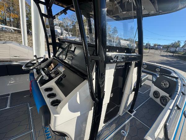 2024 Fountain 34 SC boat interior with modern dashboard and steering wheel.