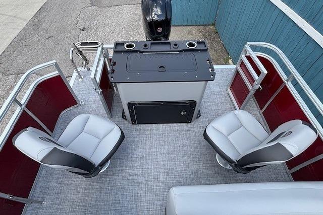 2026 Sun Tracker SportFish 20 DLX pontoon boat interior with seating and control console.