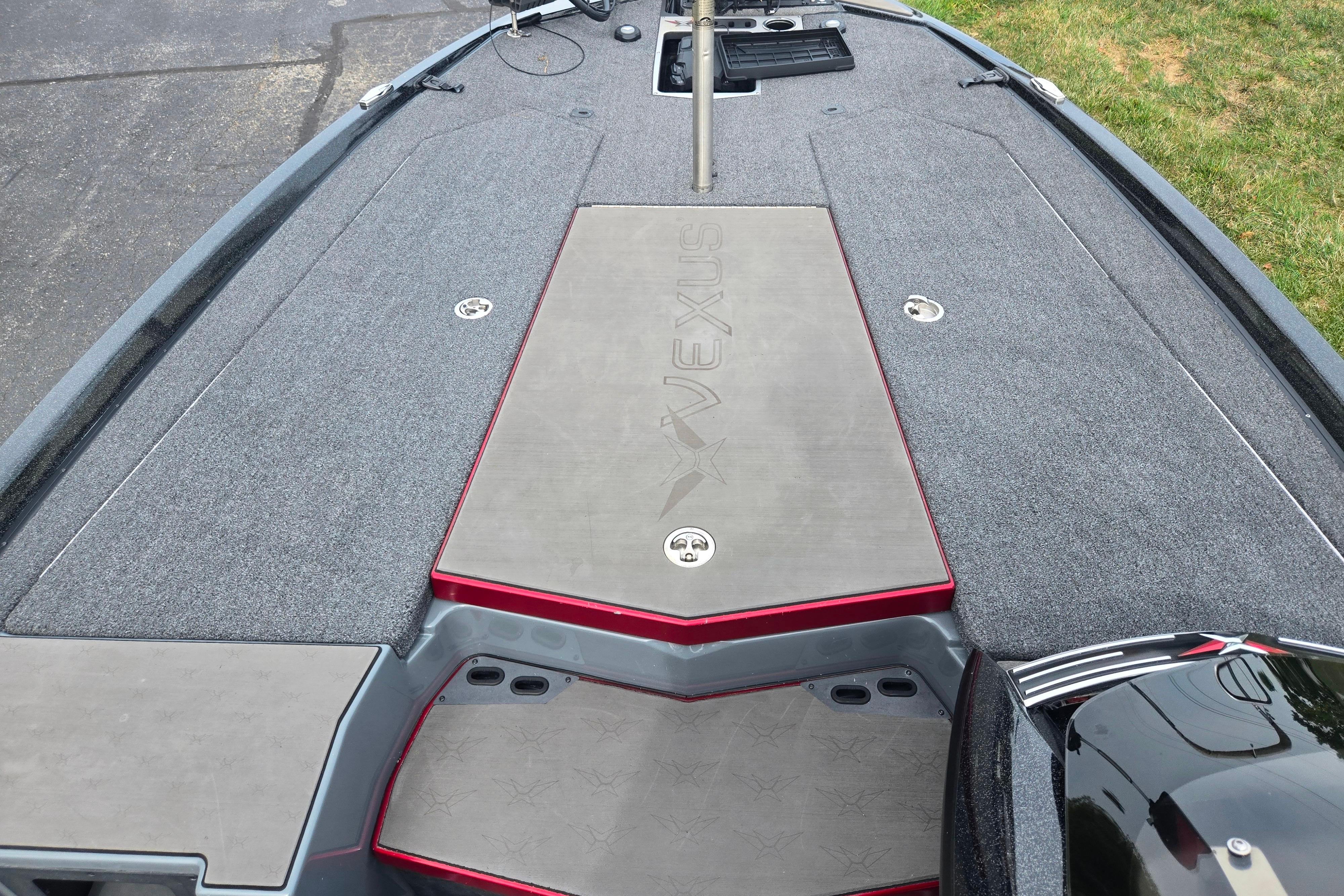 2022 Vexus VX20 boat deck with carpeted surface and storage compartments.