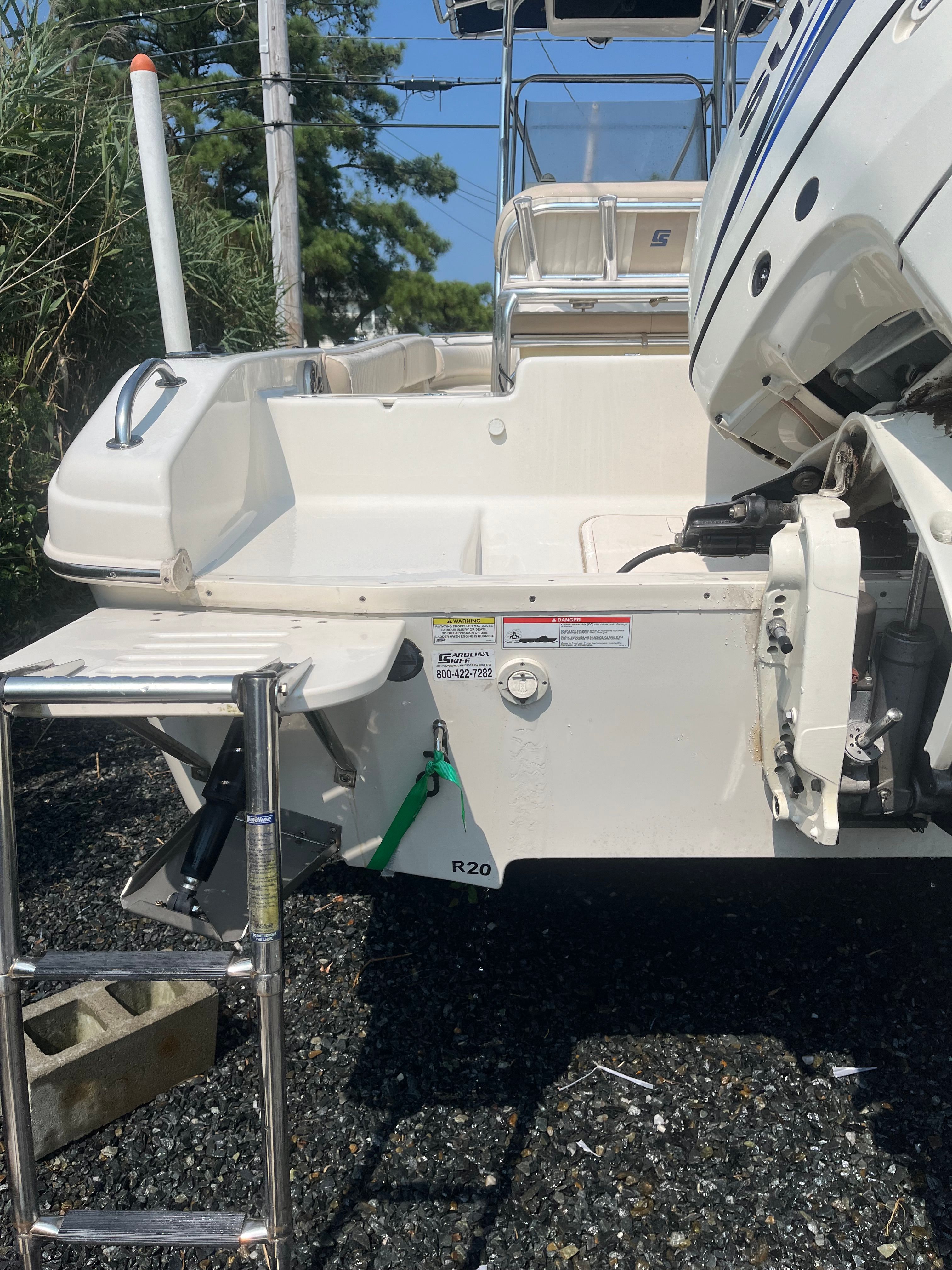 2014 Carolina Skiff 23 Ultra Elite boat with outboard motor.