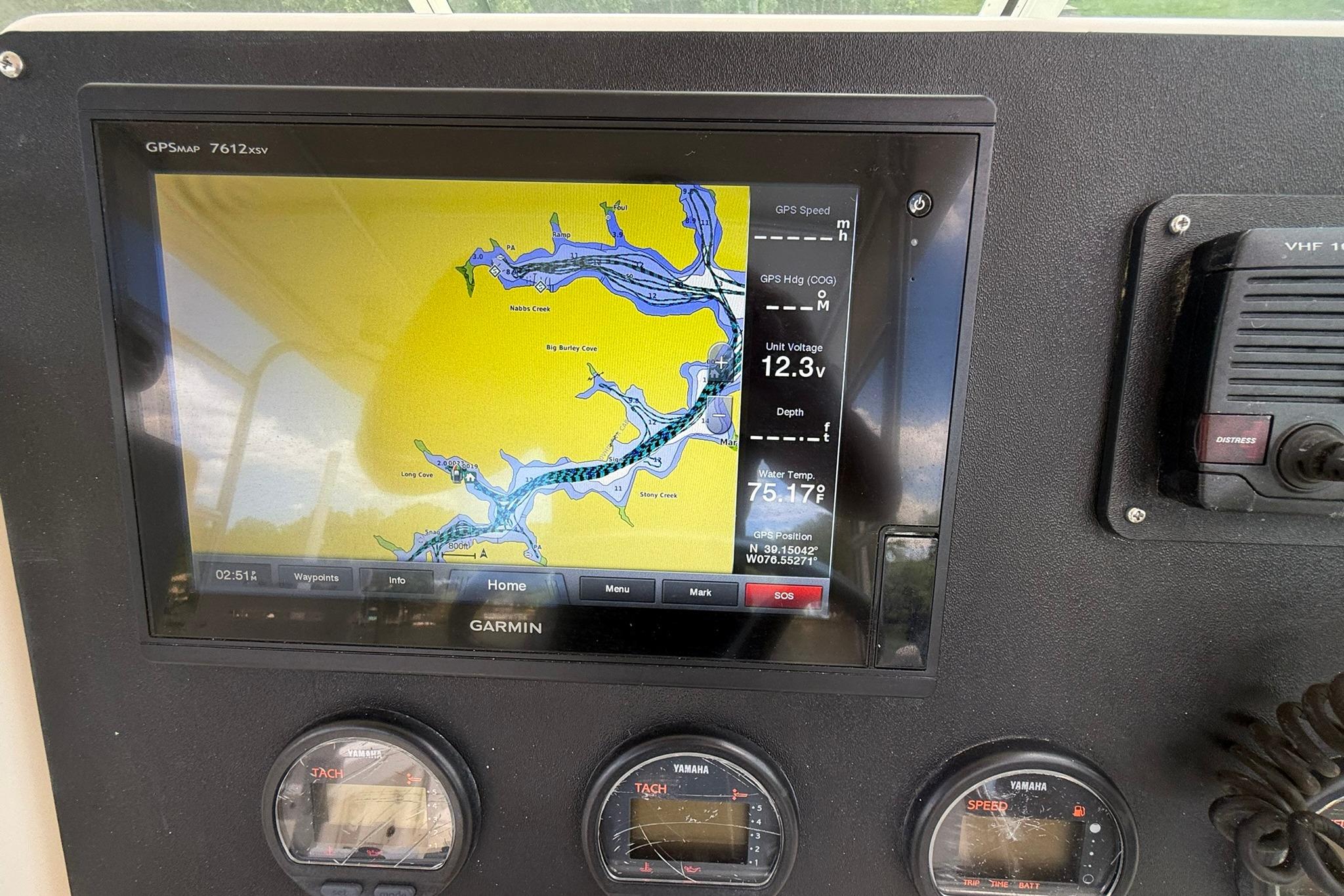 Garmin GPS display on 2003 Pursuit 2870 Walkaround boat dashboard with navigation map.