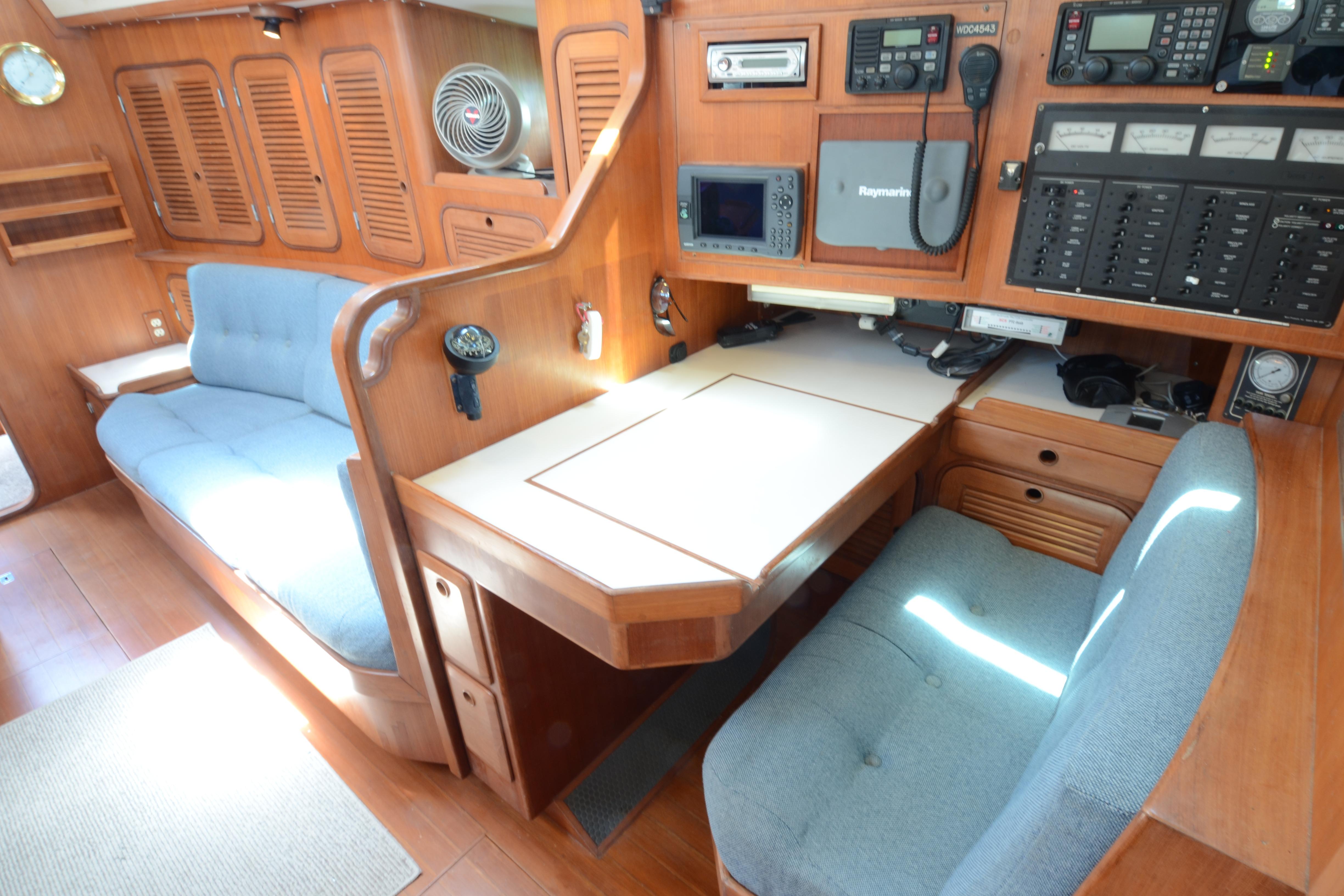 Interior of 1987 Norseman 400 yacht with navigation station and seating area.