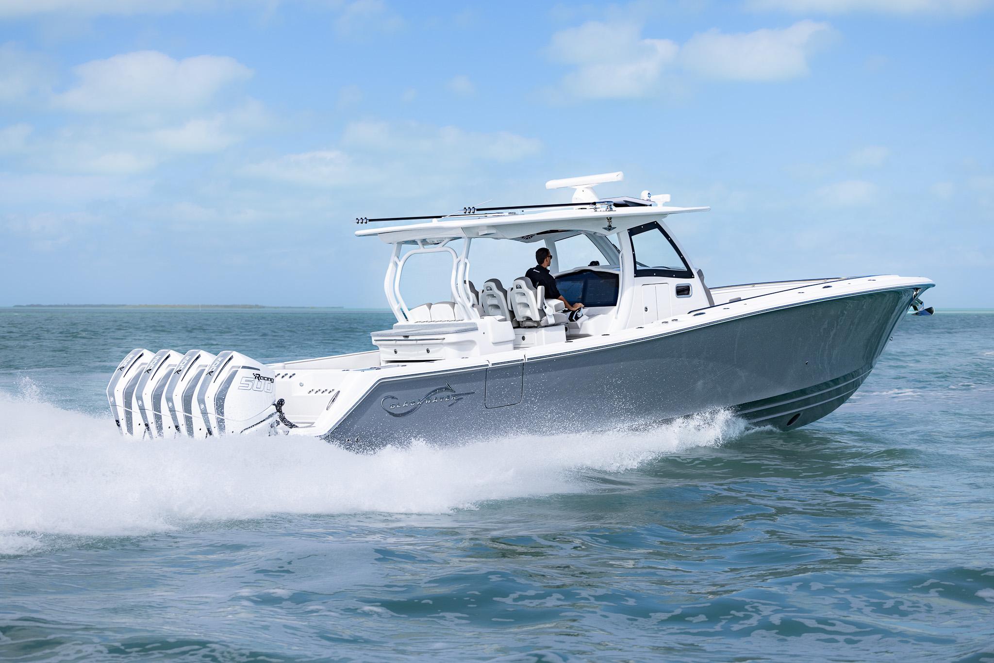 2025 Blackwater 43 Sportfish boat cruising on open water, showcasing sleek design and powerful engines.