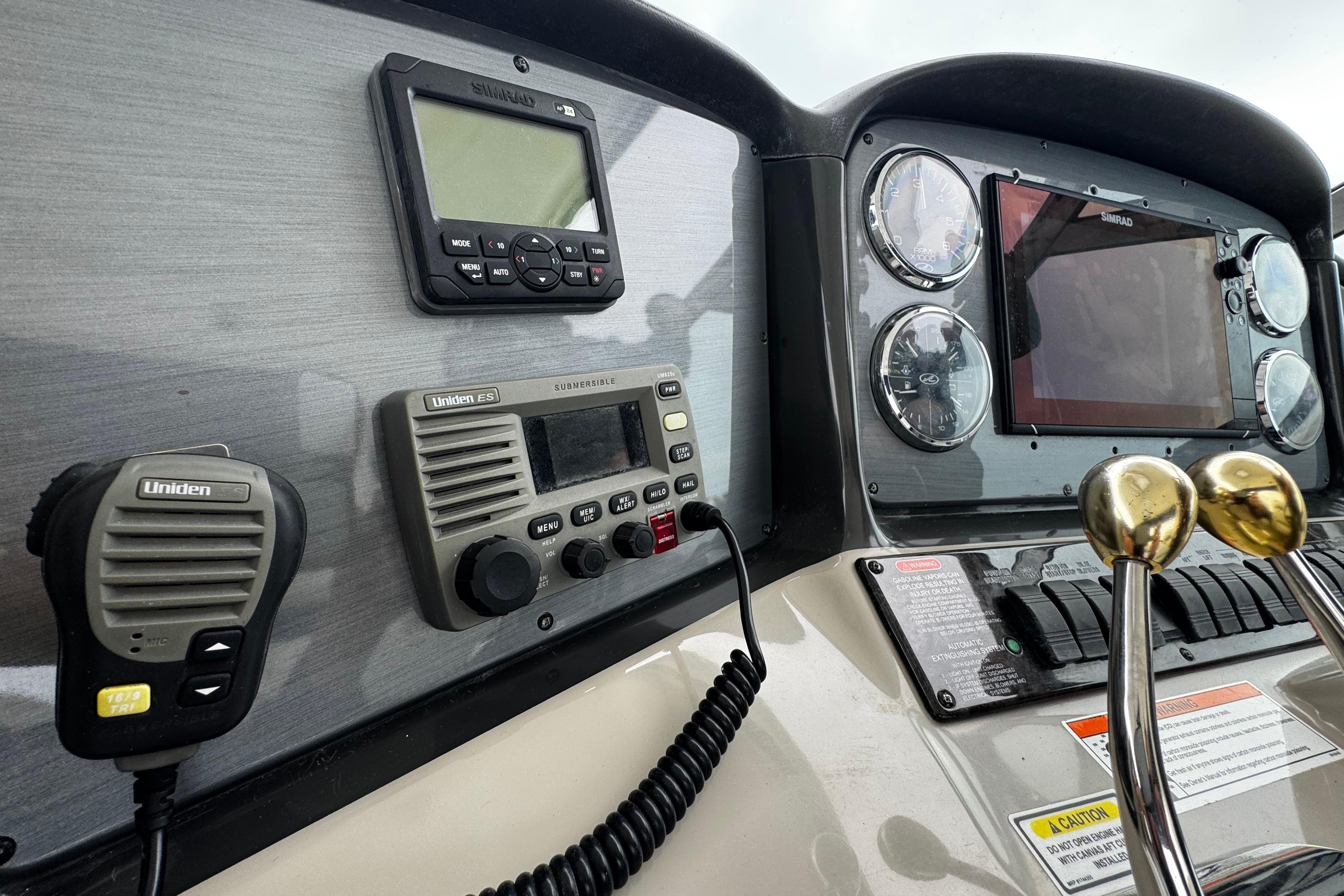 Control panel of 2006 Sea Ray 38 Sundancer with navigation and communication equipment.