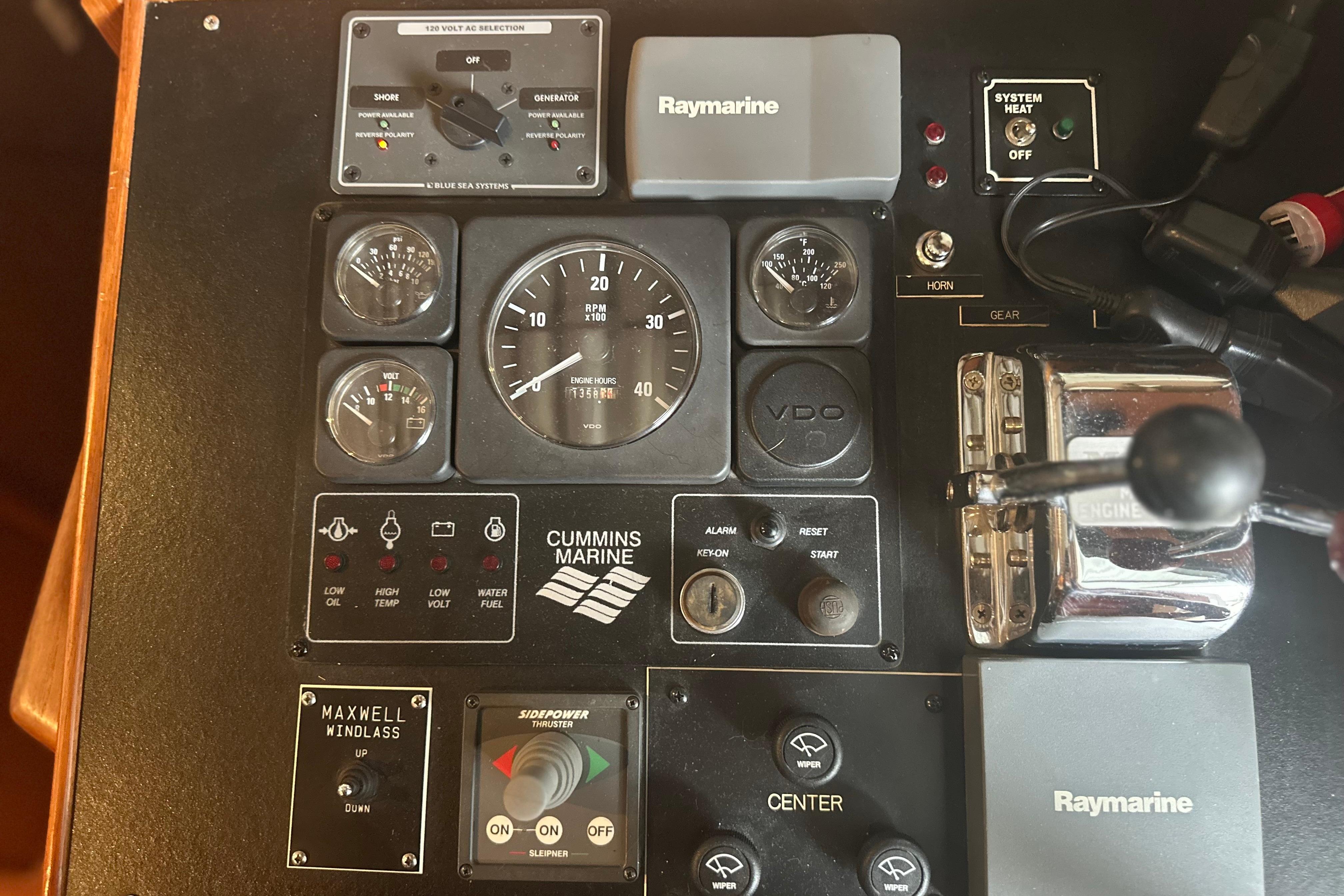 Control panel of a 2000 Island Gypsy 36 boat with Cummins Marine gauges.