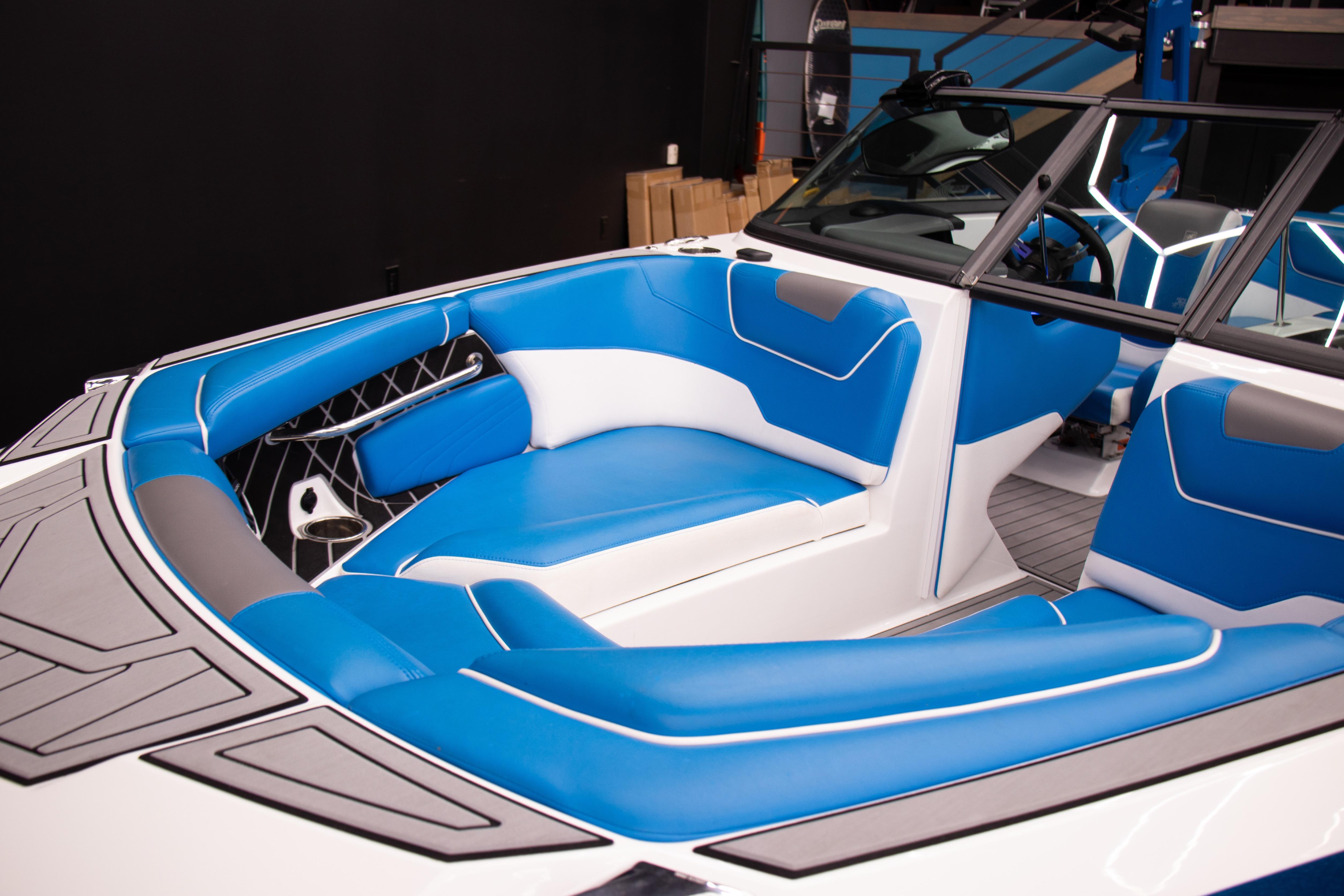 2018 Nautique Super Air Nautique GS22 interior with blue and white seating.